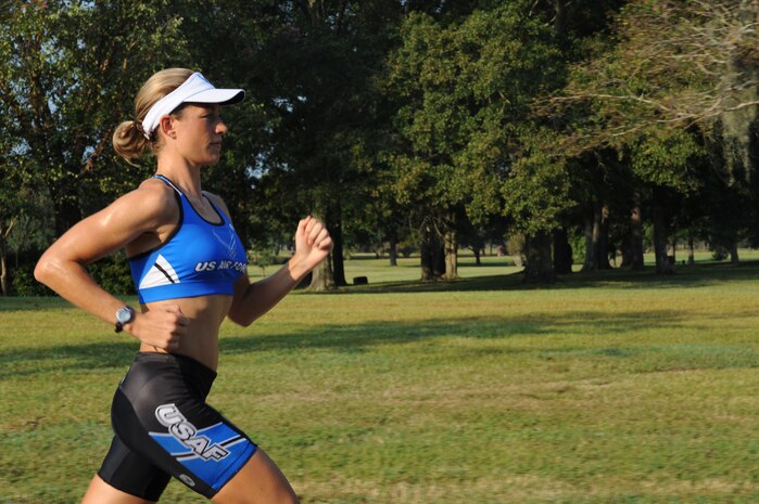 U.S. Air Force Capt. Jamie Turner runs in preparation for the Ironman World Championship at Joint Base Charleston, S.C., Sept. 21, 2010. Captain Turner is training to swim 2.4-miles through ocean waves, bike 112 miles and run a 26.2-mile marathon through challenging lava-covered terrain. During peak training, she runs 36 miles a week. Selected as one of 1,800 Ironman World Championship competitors, she will test her endurance in one of the top athletic challenges the sports world has to offer. Captain Turner is a pilot with the 315th Airlift Wing. (U.S. Air Force photo/James M. Bowman)