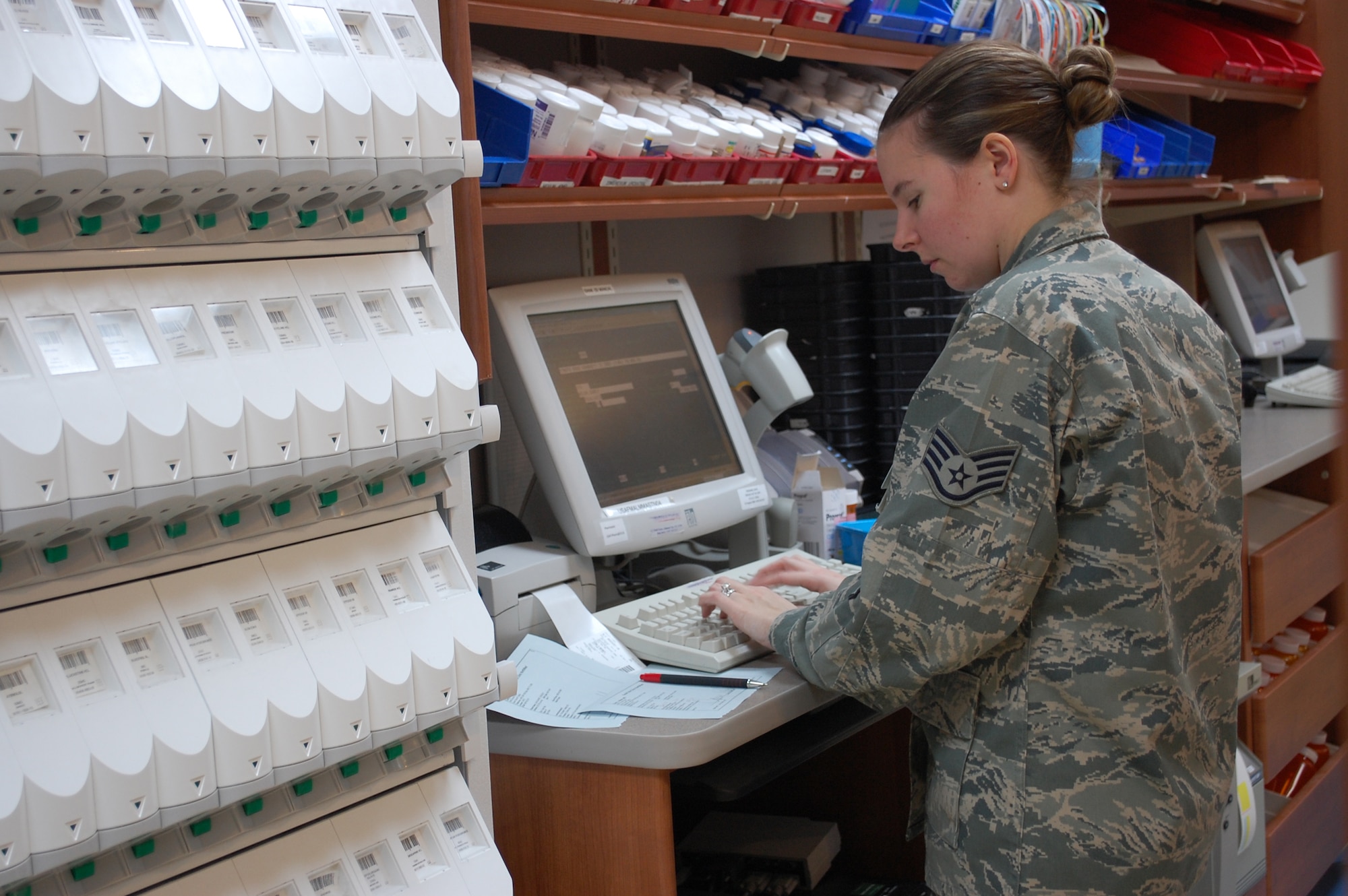 Staff Sgt. Stephanie Stagray, NCOIC of the Malmstrom pharmacy, enters a new prescription into the computer Sept. 20. Misuse of prescribed medications has been on the rise nationwide and Malmstrom leadership is taking an active role to raise awareness of this serious issue. (U.S. Air Force photo/Valerie Mullett)