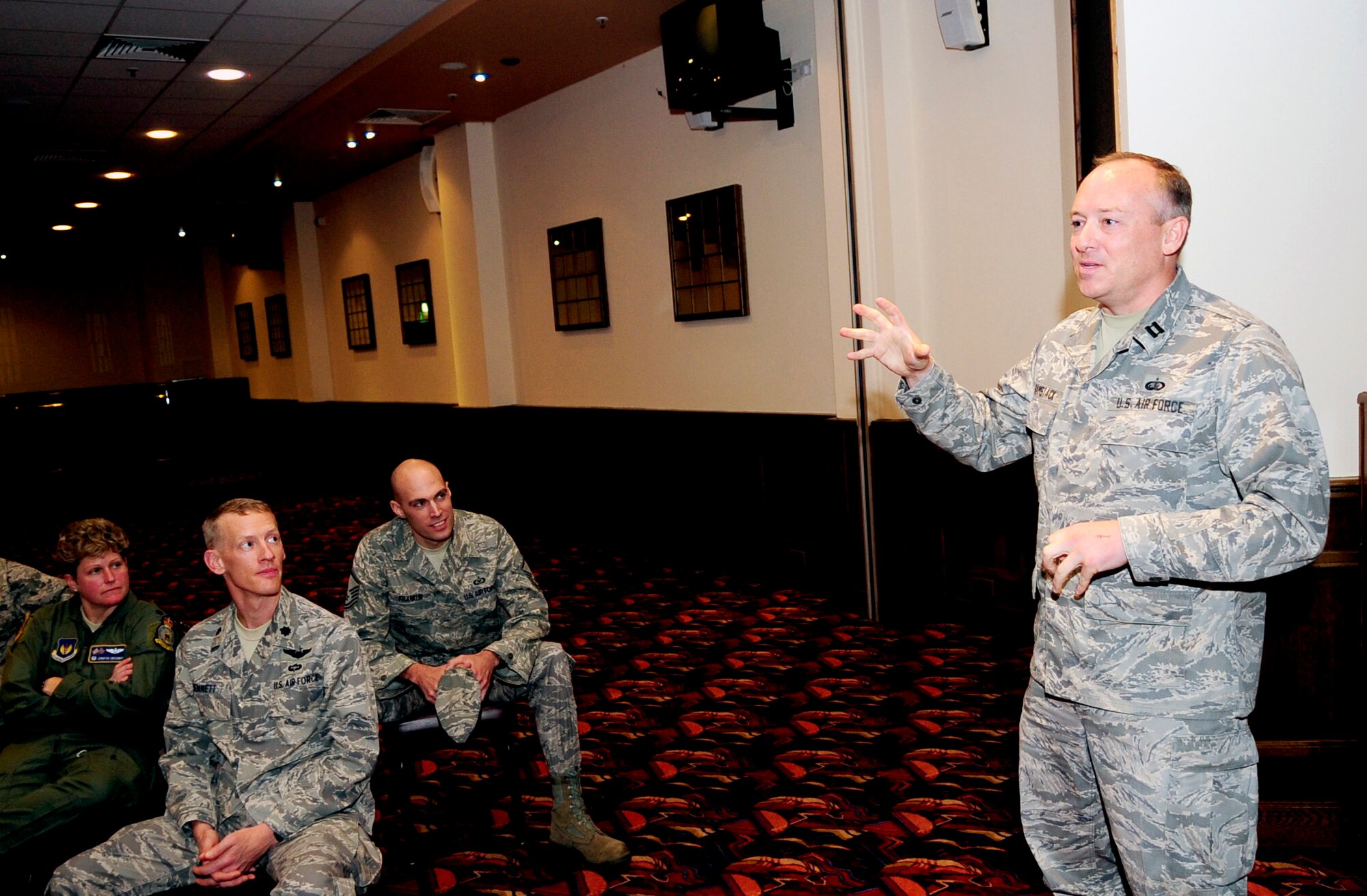 RAF MILDENHALL, England -- Capt. Mathew Ramstack, 100th Force Support Squadron, speaks about his deployment to base members during the Warrior Stories event at the Galaxy Club Sept. 22. The warrior stories program allows members to share their experiences from downrange and to help educate fellow wingmen on what to expect when it's their time to go. Master Sgt. Matthew Sutton and Tech. Sgt. Jason Peck,  both from the 100th Security Forces Squadron, also spoke at the luncheon.(U.S. Air Force photo/Senior Airman Ethan Morgan)