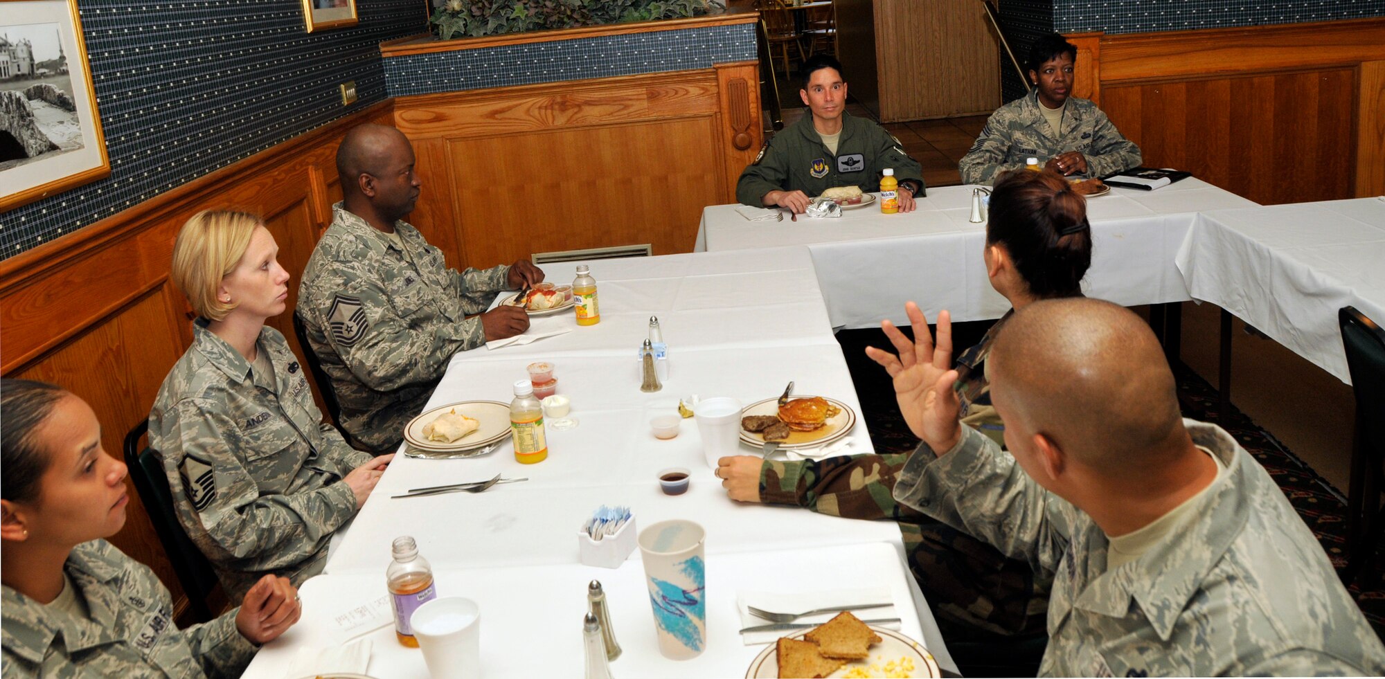 The RAF Lakenheath Top 3 Association had breakfast with Colonel John Quintas, 48th Fighter Wing commander (top left), and Chief Master Sgt. SaRita Lathan, 48th Fighter Wing command chief (top right), at Breckland Pines Golf Course at RAF Lakenheath on September 24. The informal meal was a chance for senior enlisted members to voice their opinions on current issues and upcoming events. The president of the Top Three Association here is Master Sgt. Chivita Williams. The group meets every third Wednesday at the Liberty Club at 4 p.m. (U.S. Air Force/Airman 1st Class Eboni Knox)