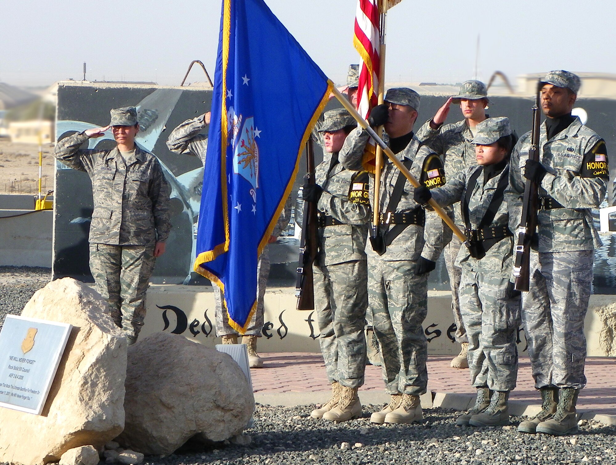 SOUTHWEST ASIA – Honor Guard members from the 386th Air Expeditionary Wing present the colors during a 9-11 memorial ceremony at an undisclosed air base here Sept. 11, 2010. The team’s movements are executed with extreme precision as they perform at various ceremonies around the base.  (U.S. Air Force courtesy photo)