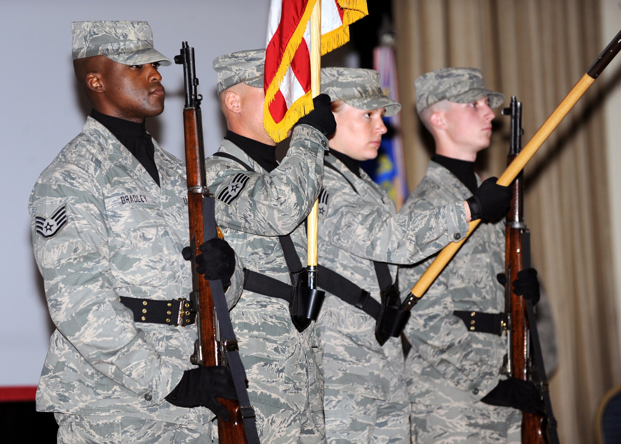SOUTHWEST ASIA ? Honor Guard members with the 386th Air Expeditionary Wing present the colors during a ceremony at an undisclosed air base here. The team?s movements are executed with extreme precision as they perform at various ceremonies around the base. (U.S. Air Force photo by Senior Airman Laura Turner)
