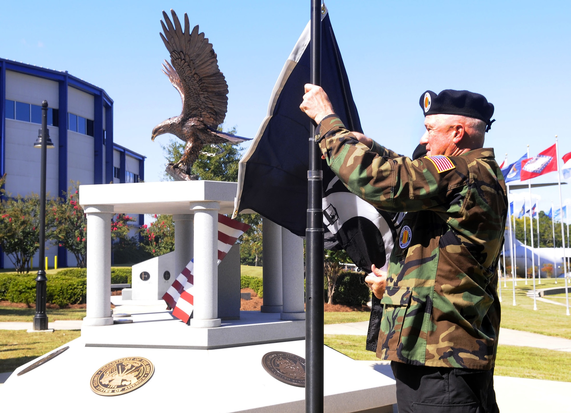 Dave Garland, Vietnam Veterans of America Chapter 902, attaches the POW/MIA flag to be raised at the POW/MIA Recognition Day ceremony at the Museum of Aviation Sept. 16. U. S. Air Force photo by Sue Sapp