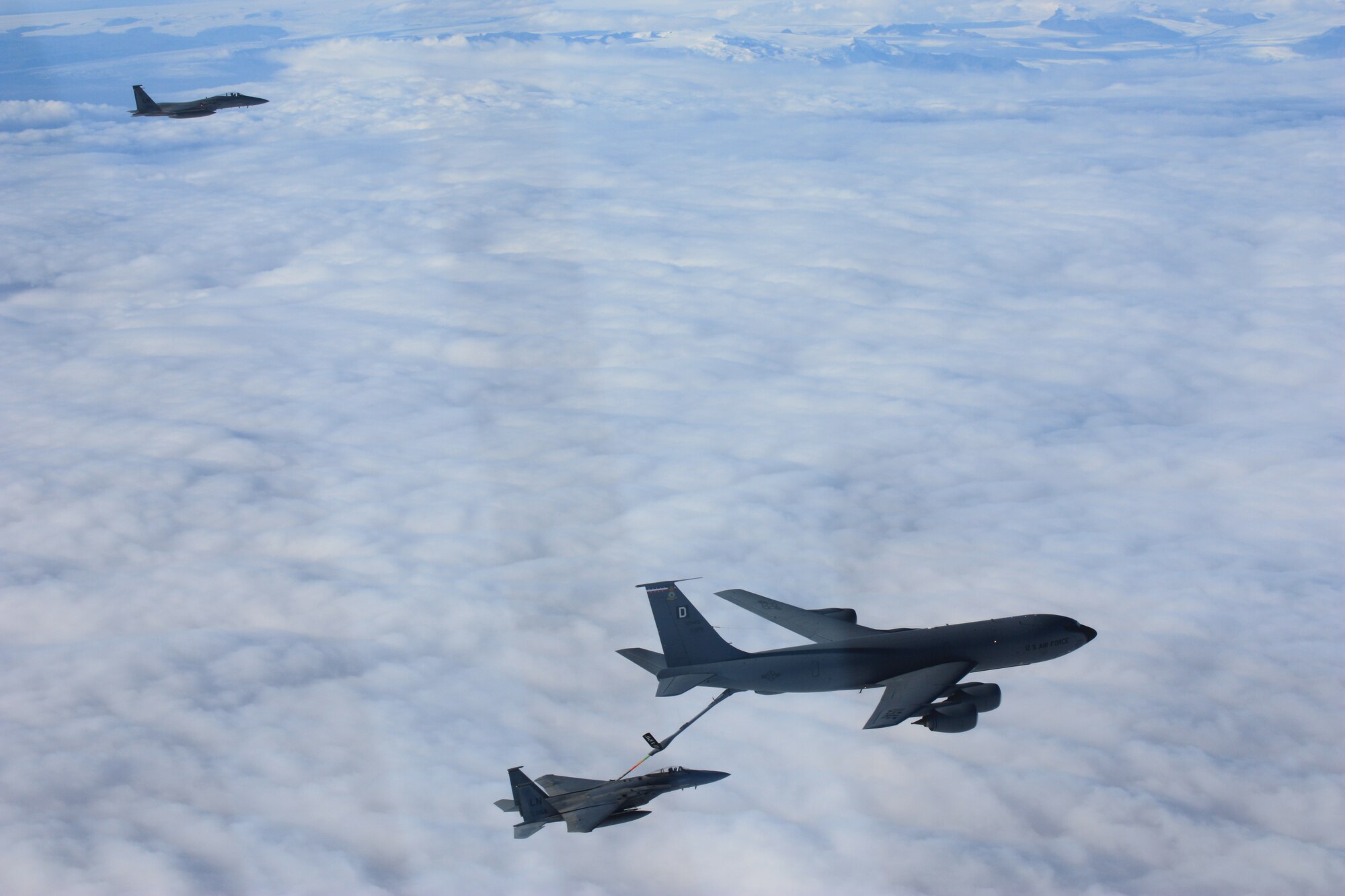 KEFLAVIK, Iceland – A KC-135 Stratotanker refuels an F-15C Eagle while another aircraft waits in queue Sept. 15, 2010. The 493rd Expeditionary Fighter Squadron is comprised of a specialized team of its own to ensure Iceland's air sovereignty. In addition to the Airmen from the 48th Fighter Wing, there are Airmen from as close as the 100th Air Refueling Wing at RAF Mildenhall, England, and as far away as the 56th Training Squadron at Luke Air Force Base, Ariz. (U.S. Air Force photo/Maj. Andrew Rose)