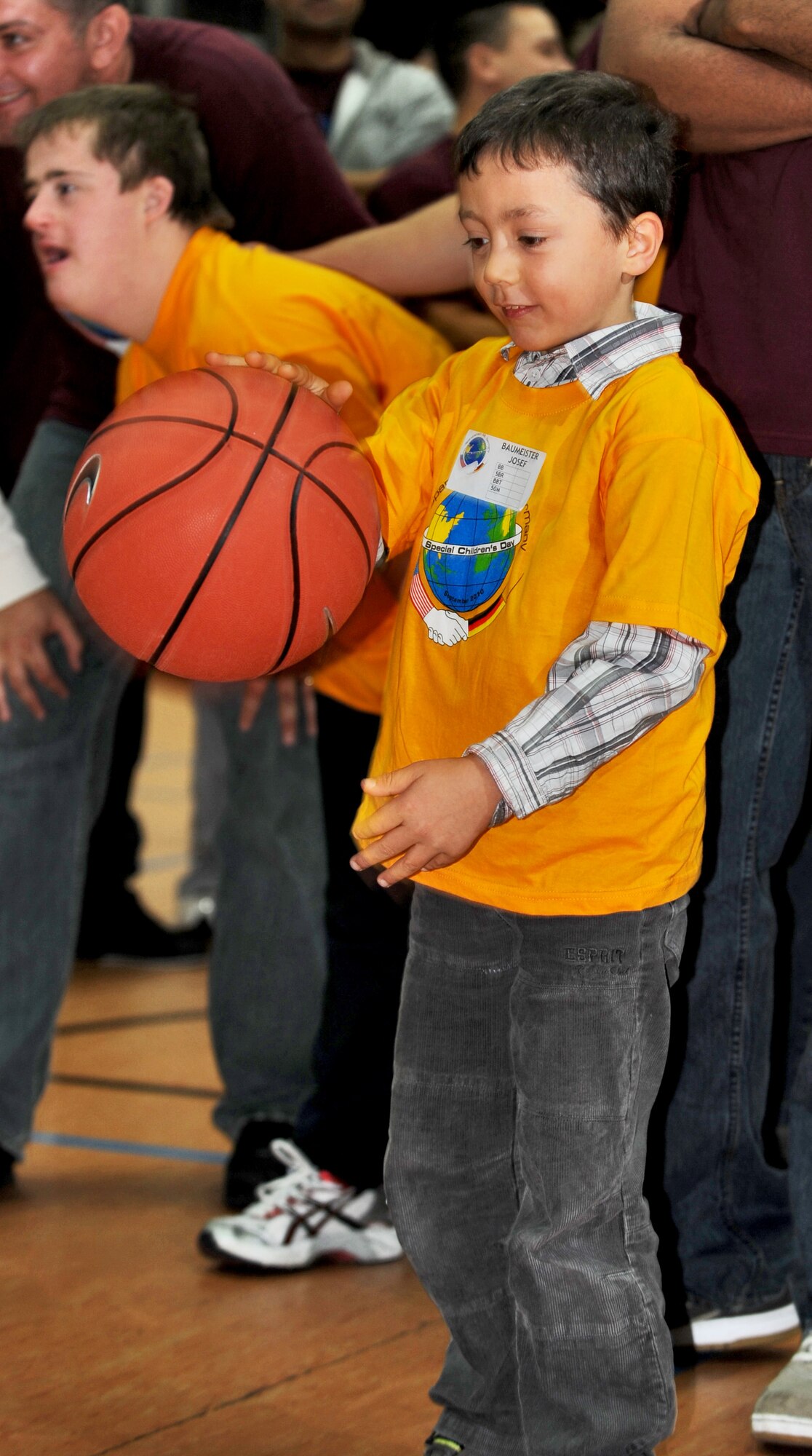 SPANGDAHLEM AIR BASE, Germany – Josef Baumeister, a child participating in the St. Martin’s Special Children’s Day games, practices bouncing a basketball Sept. 23. This was the 15th year Spangdahlem Air Base hosted this event that included several individual games, a cookout, basketball game and an awards ceremony. (U.S. Air Force photo/Senior Airman Nick Wilson)
