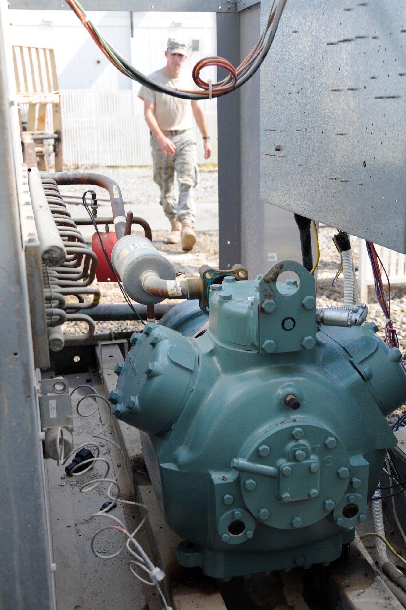 Tech. Sgt. Matthew Myers, 380th Expeditionary Civil Engineer Squadron heating ventilation and air conditioning technician, prepares to work on an air conditioner compressor Sept. 23, 2010 at an undisclosed location in Southwest Asia. (U.S. Air Force photo/Tech. Sgt. April Wickes)