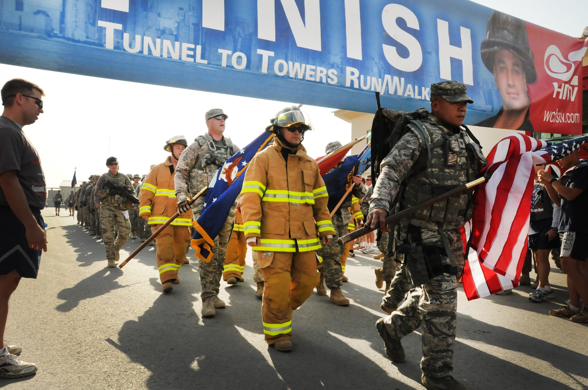 100924-N-6031Q-011 KABUL, Afghanistan - NATO Air Training Command- Afghanistan personnel alongside NATO and civilian partners participate in the "Tunnel to Towers run/walk race on Sep. 24, 2010. The race was held on the International Security Assistance Force and Afghan Air Force base in Kabul, Afghanistan. The race is to commemorate the arduous run made by New York City Firefighter Stephen Siller, who during the events of 9/11 picked up his gear weighing 75 pounds and ran to the twin towers nearly three miles away and perished alongside his fellow firefighters in the attempt to save lives. After the race a piece of steel was placed in a memorial on the grounds of the AAF base where it will stay until the last American leaves Afghanistan. (US Navy photo by Mass Communication Specialist 2nd Class David Quillen/ RELEASED).