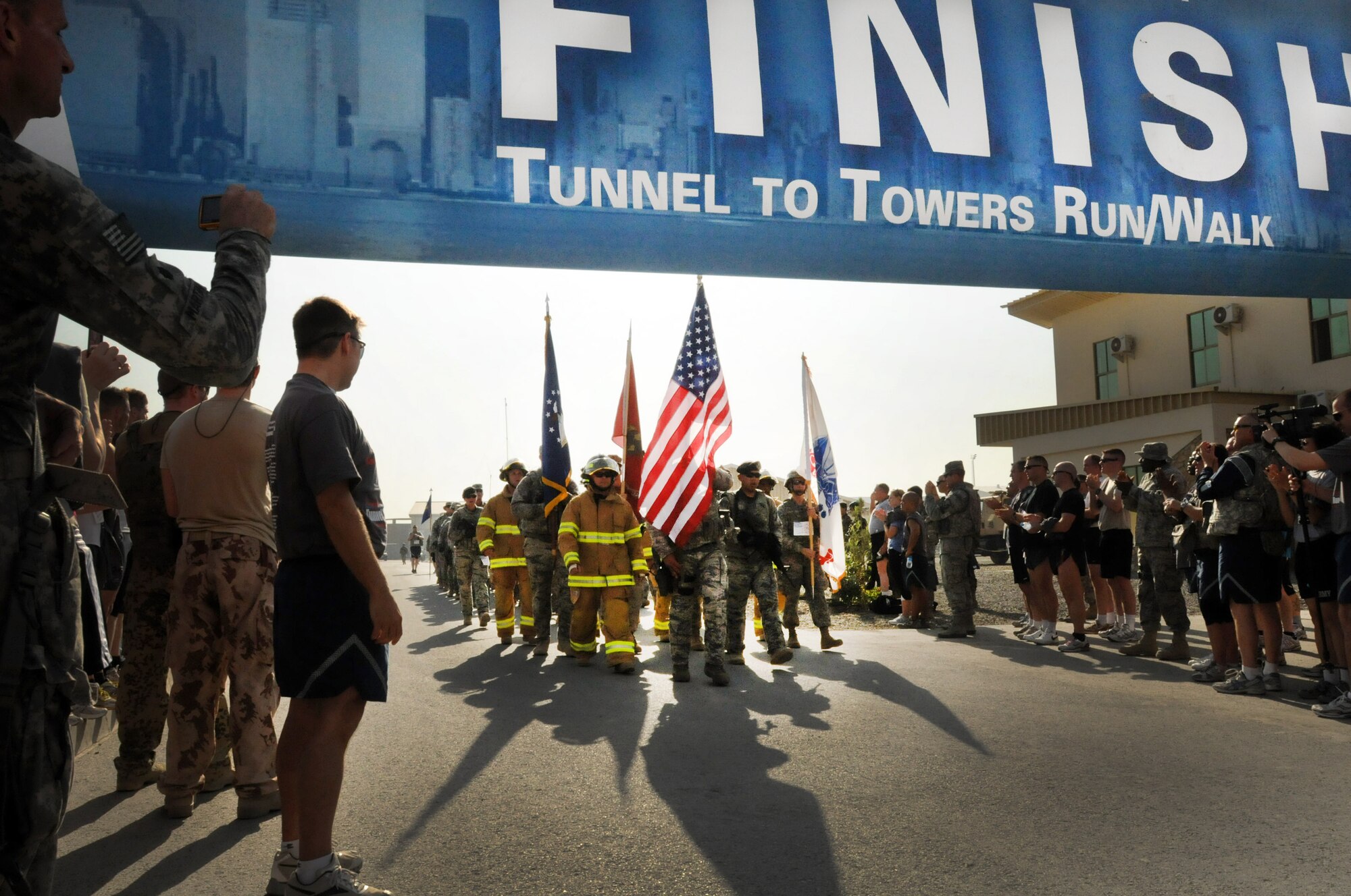 100924-N-6031Q-010 KABUL, Afghanistan - NATO Air Training Command- Afghanistan personnel alongside NATO and civilian partners participate in the "Tunnel to Towers run/walk race on Sep. 24, 2010. The race was held on the International Security Assistance Force and Afghan Air Force base in Kabul, Afghanistan. The race is to commemorate the arduous run made by New York City Firefighter Stephen Siller, who during the events of 9/11 picked up his gear weighing 75 pounds and ran to the twin towers nearly three miles away and perished alongside his fellow firefighters in the attempt to save lives. After the race a piece of steel was placed in a memorial on the grounds of the AAF base where it will stay until the last American leaves Afghanistan. (US Navy photo by Mass Communication Specialist 2nd Class David Quillen/ RELEASED).
