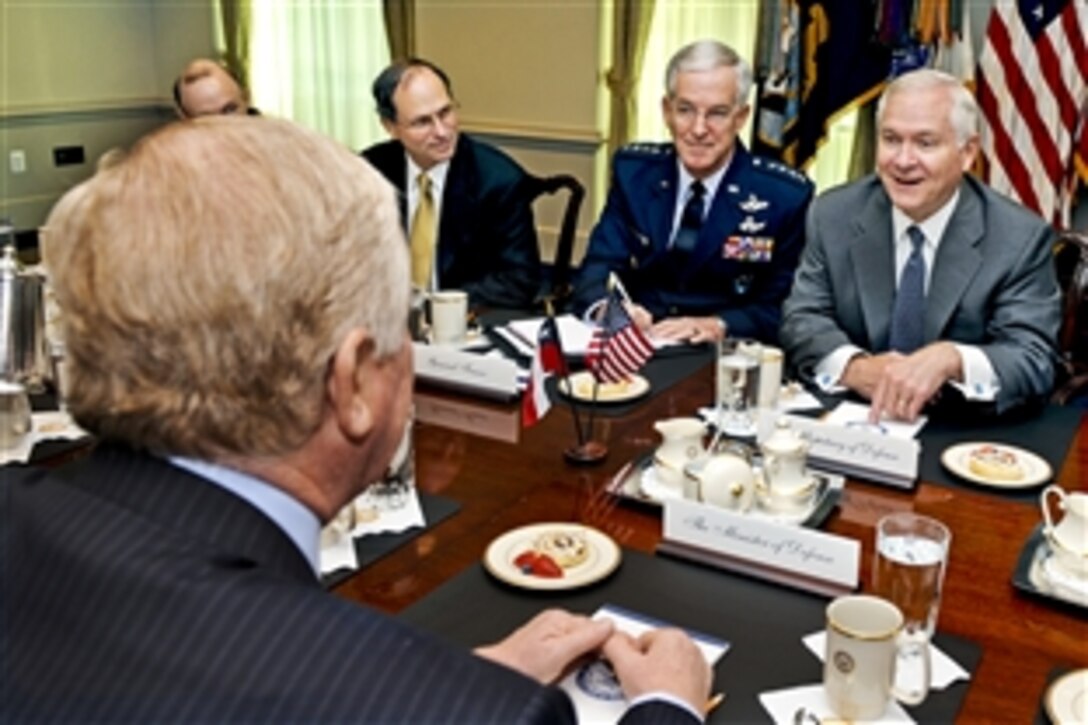 U.S. Defense Secretary Robert M. Gates, right, hosts a meeting with Chilean Defense Minister Jaime Ravinet at the Pentagon, Sept. 24, 2010.  U.S. Air Force Gen. Douglas Fraser, center, commander of U.S. Southern Command, and Paul Stockton, assistant secretary of defense for homeland defense and Americas' security affairs, joined Gates at the table.  