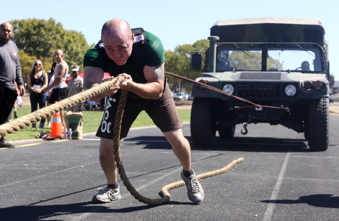 Cpl. Dillon Campbell, bulk fuel engineer, 7th Engineer Support Battalion, pulls a humvee during Camp Pendleton’s 10th annual Strongest Warrior Competition, Sept. 24. The competition is an athletic event in which service members can compete in various timed repetition-measured strength and endurance courses. In addition to the Jeep Pull, the courses included the Tire Flip, the Farmer’s Walk, the Military Press, and a Stone Carry.