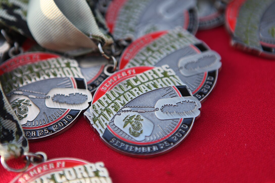 Race medals line the awards table during the Marine Corps Community Services’ 24th annual Marine Corps Half Marathon aboard Marine Corps Base Camp Lejeune, Sept. 25.  The athletes ran 13.1 miles, and everyone who crossed the finish line received a T-shirt, towel and race medal.