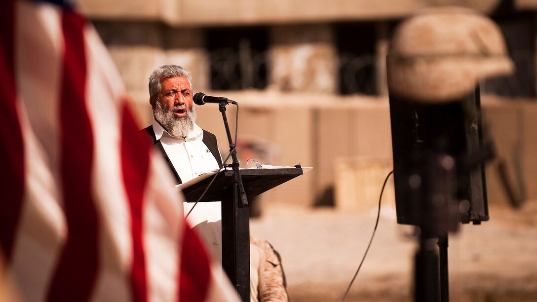 Haji Abdul Manaf, the Nawa District governor, speaks of 1st Lt. Scott J. Fleming’s sacrifice during a memorial service honoring the life of Fleming at Patrol Base Jaker, Afghanistan, Sept. 25, 2010. Fleming died supporting combat operations Sept. 17, 2010.