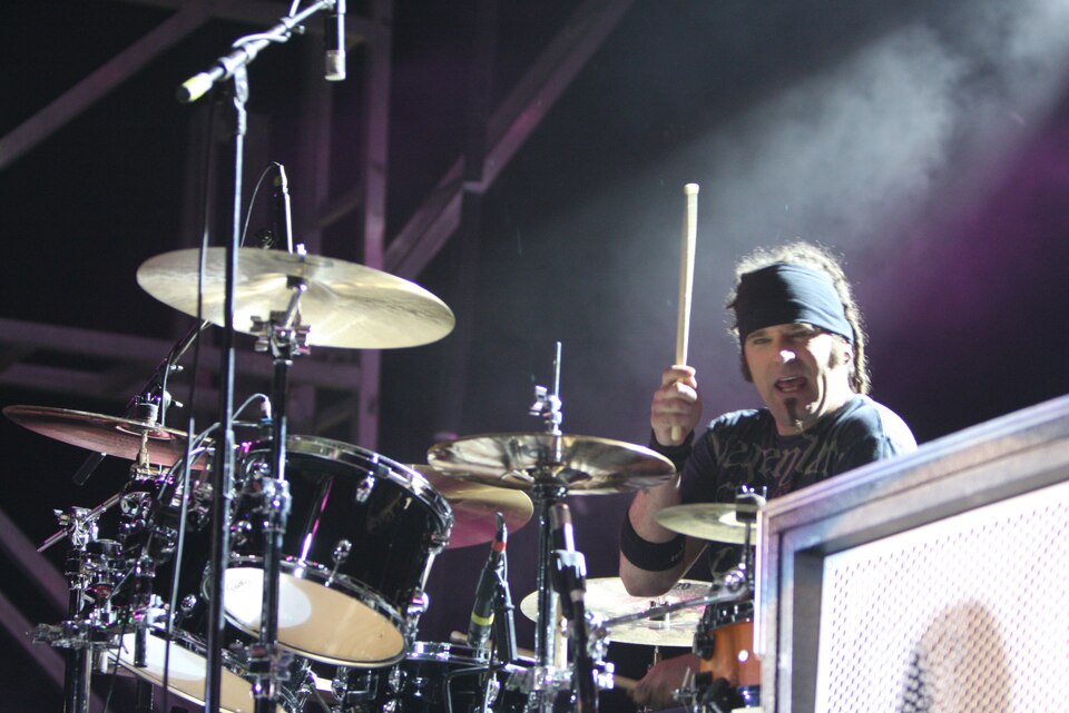 Paul Crosby, drummer for Saliva, jams while putting on a show for the Combat Center Commuity. The 2010 Sounds of Freedom Rock Festival featured rock groups Seether and Saliva. (U.S. Marine Corps phot by Lance Cpl. William J. Jackson)::r::::n::