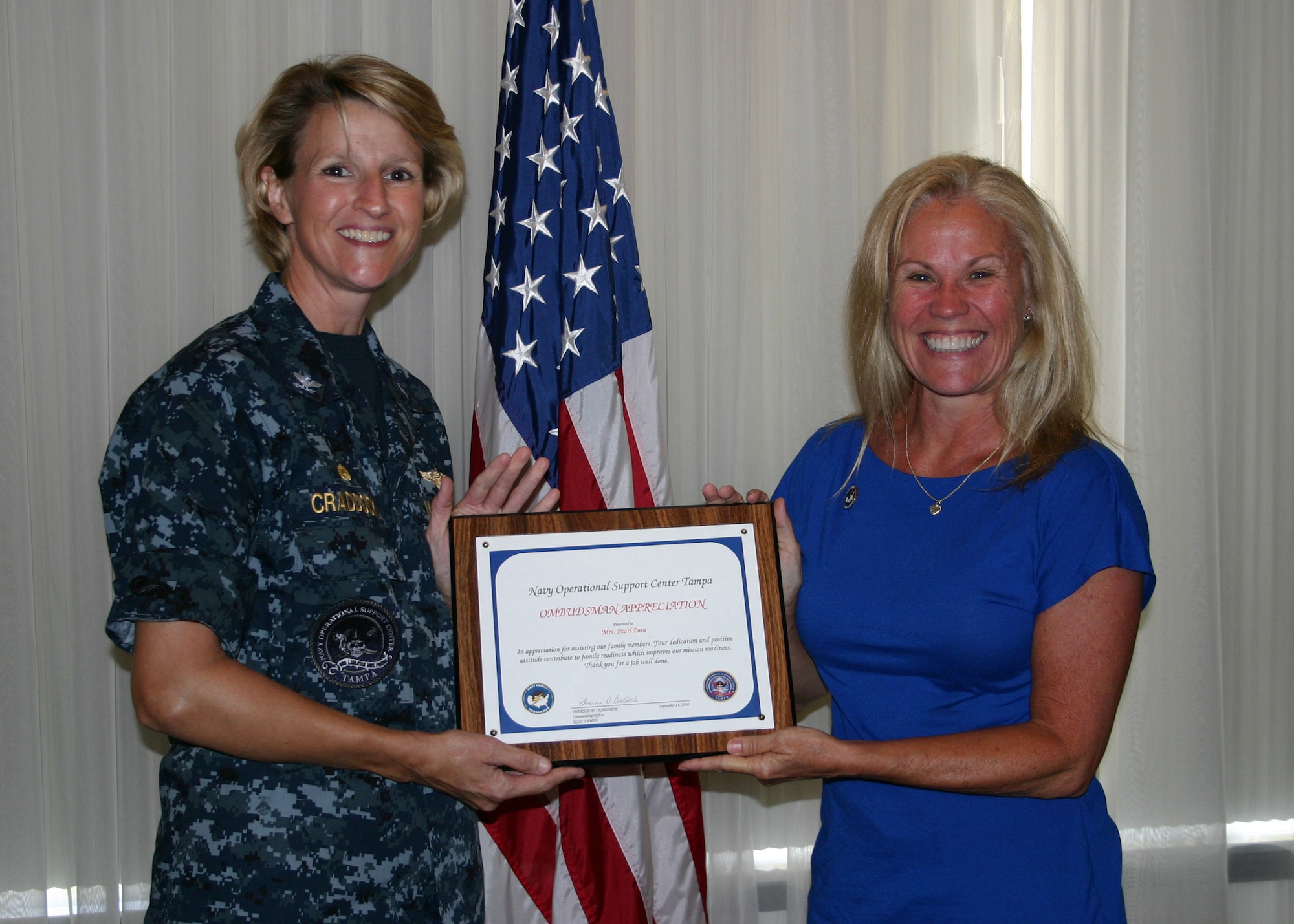 TAMPA, Fla., Navy Operational Support Center Tampa’s Commanding Officer, Capt. Therese Craddock, presented an Ombudsman Appreciation Certificate to Pearl Para at a luncheon Sept. 14. Ombudsmen are trained to moderate issues affecting military families and assist in the resolution of those issues that could later require command attention. (U.S. Navy photo by Petty Officer 1st Class Christine Hannon/Released)