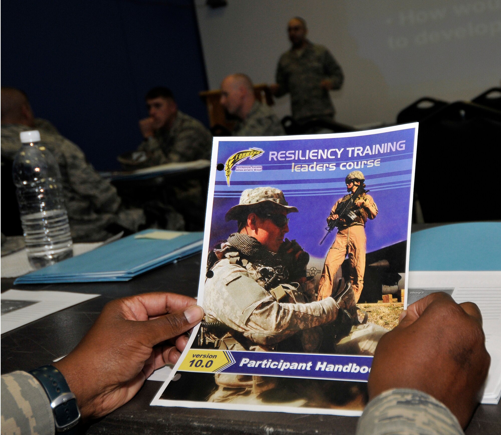 Servicemembers from across Joint Base Balad, Iraq receive resiliency training in the MWR East movie room Sept. 14, 2010, to help them become better leaders and assist others to deal with high-stress situations by showing them different leadership styles. The beginning of the program was an orientation of what the program teaches followed by a train-the-trainer session, which focused on delivering messages as an instructor. (U.S. Air Force photo/Staff Sgt. Phillip Butterfield)