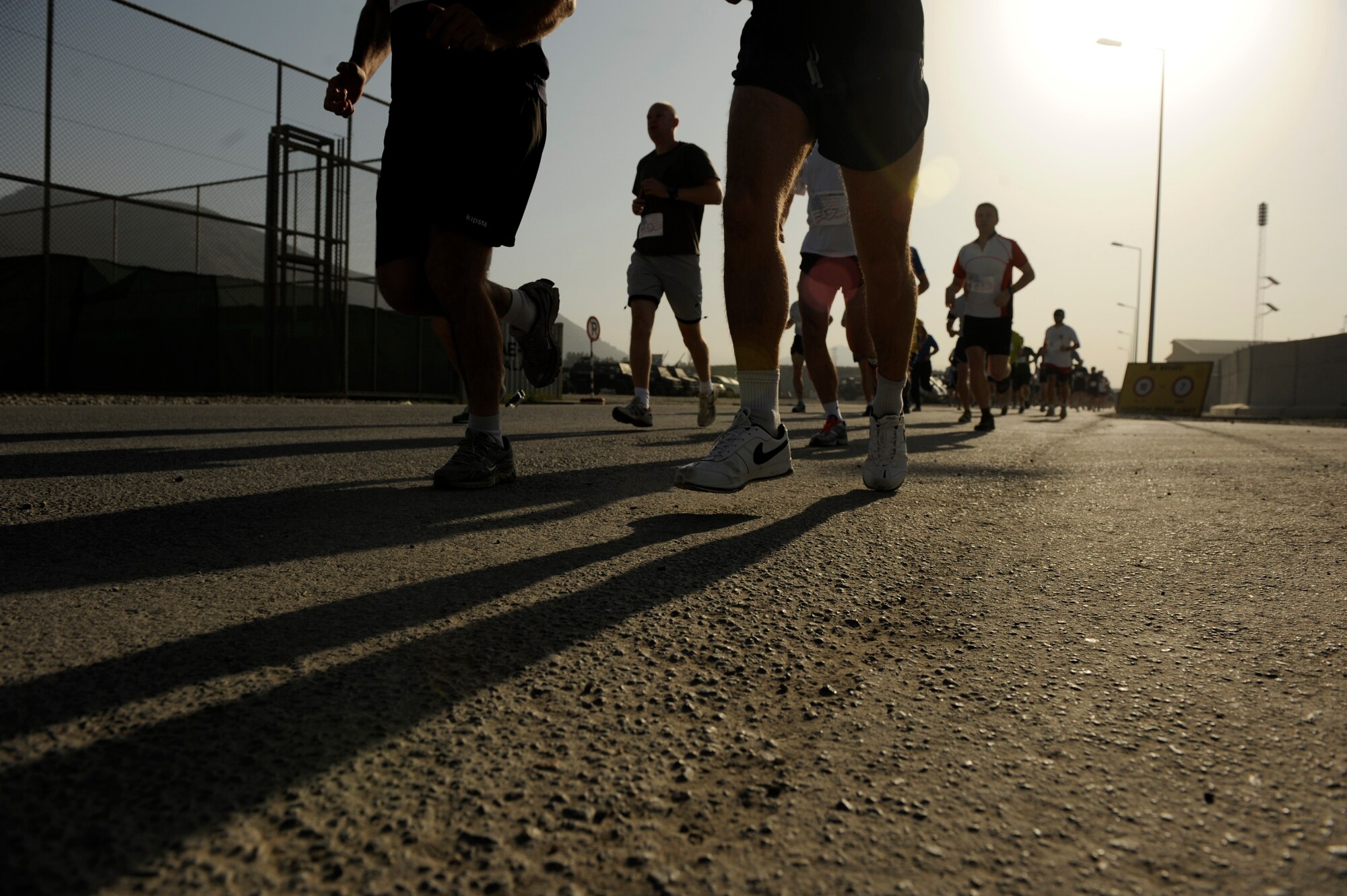 Runners participate in The Firefighter Stephen Siller Tunnel to Towers 5k Run/Walk at Kabul International Airport, Afghanistan, Sept. 24, 2010.  Nearly 400 runners participated in honor of all those that gave their lives on Sept. 11, 2001.  (U.S. Air Force Photo/Staff Sgt. Eric Harris) (RELEASED)