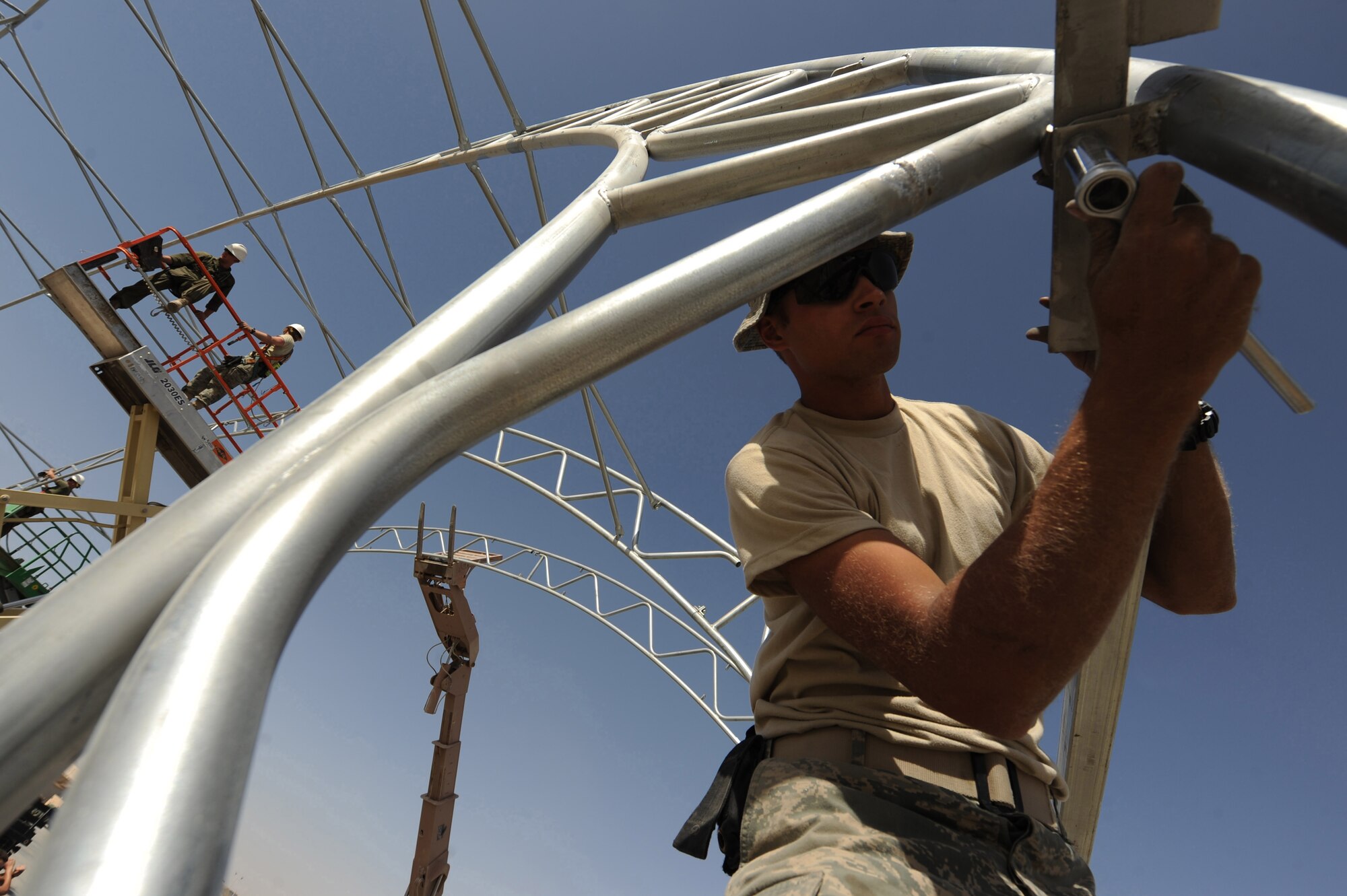 Senior Airman Jonathan Carmona secures square tubing to a metal frame Sept. 23, 2010, at Kandahar Airfield, Afghanistan.  Airman Carmona is a structural journeyman assigned to the 777th Expeditionary Prime Beef Squadron.  (U.S. Air Force photo by Tech. Sgt. Chad Chisholm/Released)