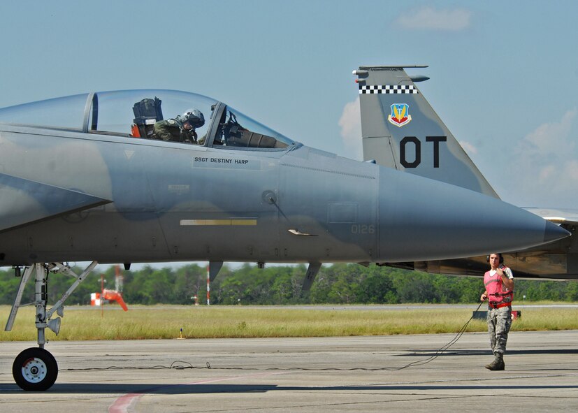 A 46th Test Wing maintainer prepares a 53rd Wing F-15 for take-off from Eglin Air Force Base, Fla.  More than 1,000 personnel of the 46th Maintenance Group are responsible for maintenance procedures for all of the 46th and 53rd aircraft located at Eglin.  (U.S. Air Force photo/Samuel King Jr.) 