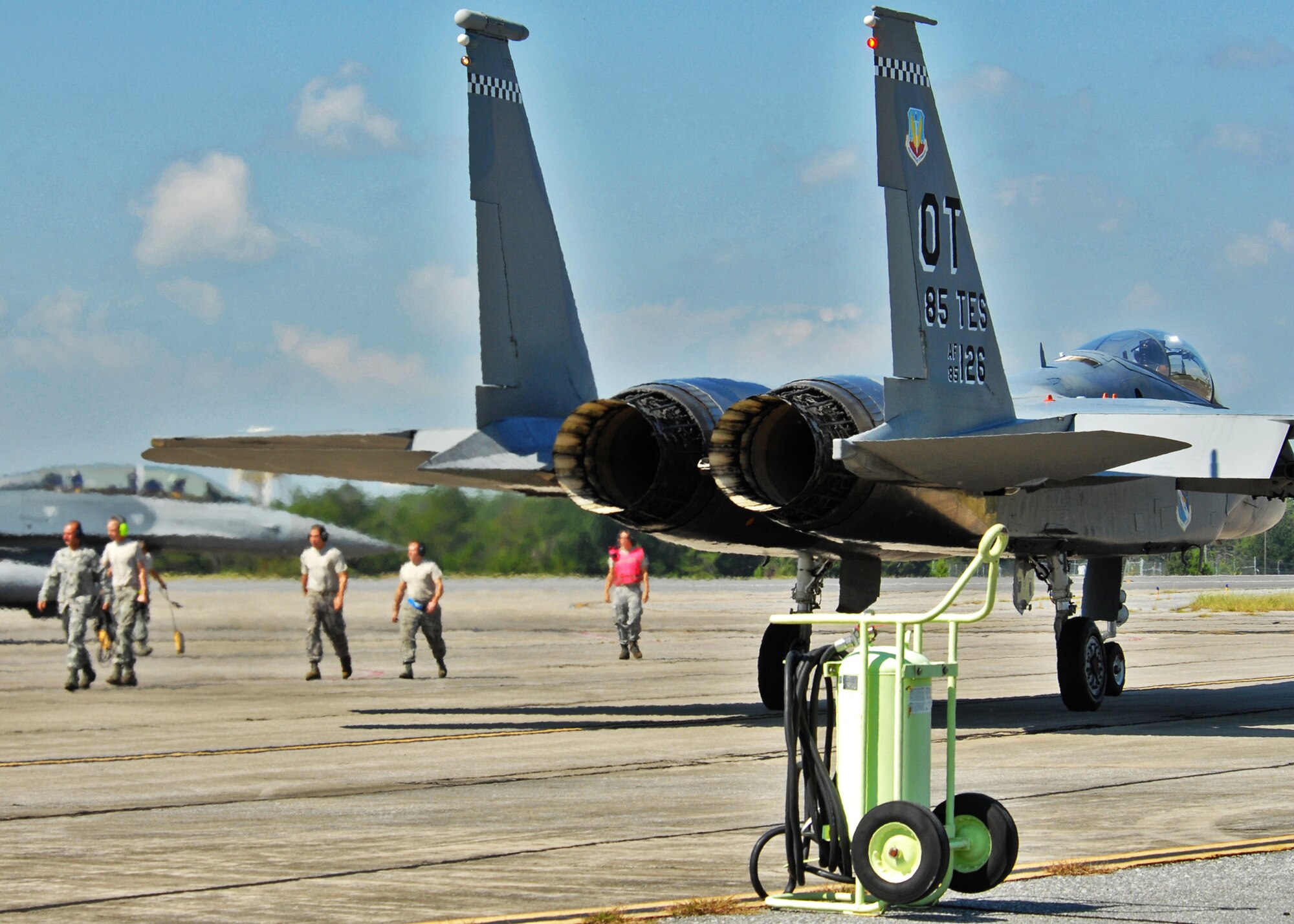 A group of 46th Test Wing maintainers walks away after arming 53rd Wing aircraft for take-off from Eglin Air Force Base, Fla.  More than 1,000 personnel of the 46th Maintenance Group are responsible for maintenance procedures for all of the 46th and 53rd aircraft located at Eglin.  (U.S. Air Force photo/Samuel King Jr.) 