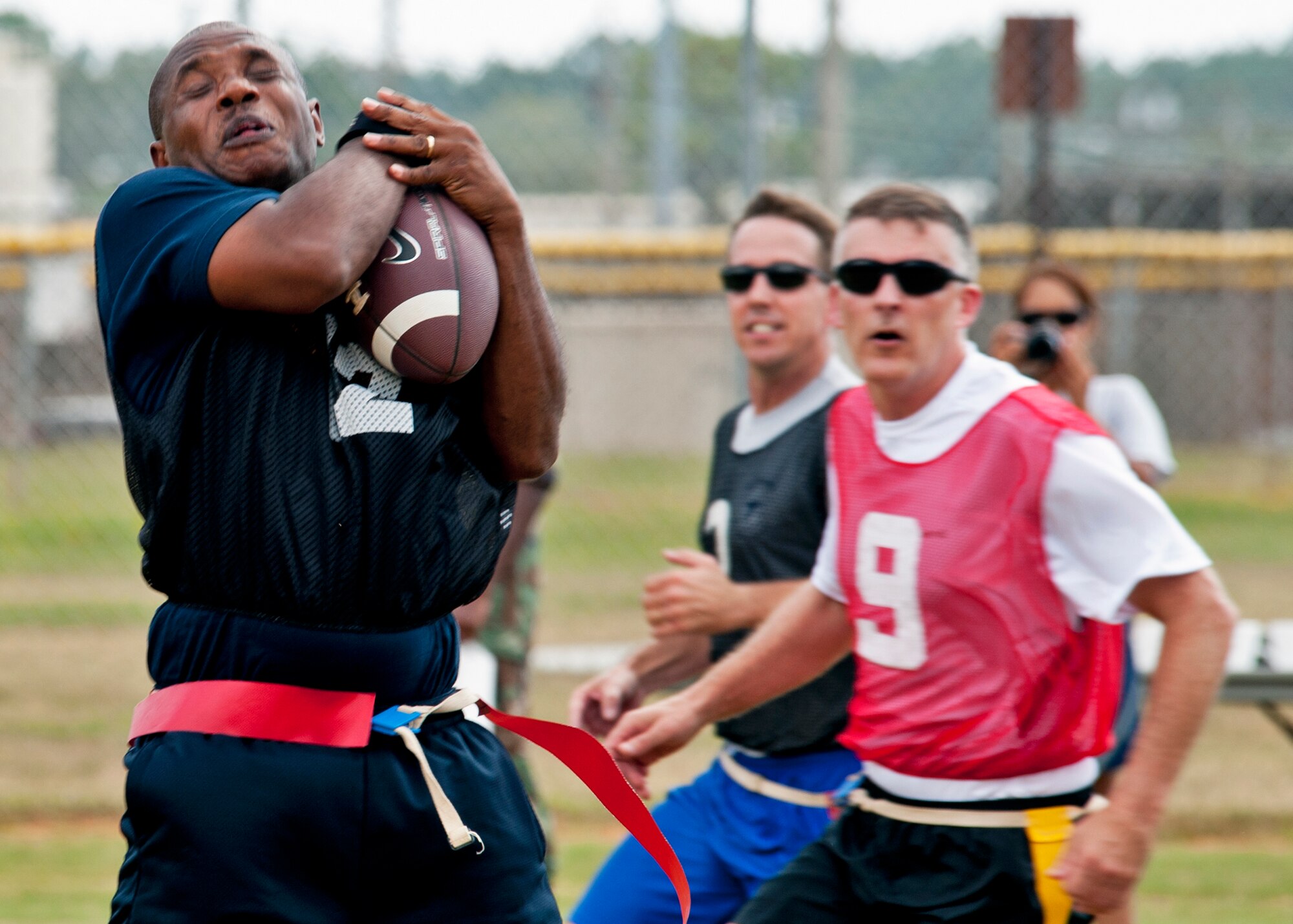 Chief Master Sgt. Robert Daniels, 96th Logistics Readiness Squadron, comes down with a reception during the Chiefs vs Eagles flag football game Sept. 24 at Eglin Air Force Base, Fla.  The Chiefs crushed the Eagles 34-13.  (U.S. Air Force photo/Samuel King Jr.)