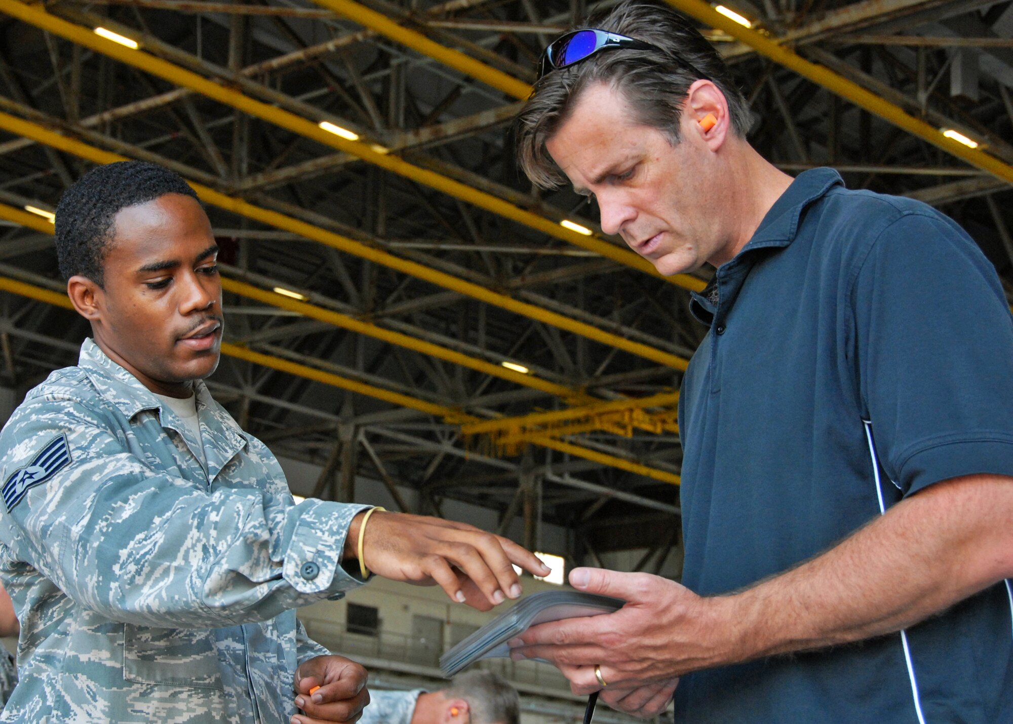 Bart Swan, honorary commander for the 46th Operations Group, goes over the checklist that must be accomplished for each bomb loaded to an aircraft Sept. 22 at Eglin Air Force Base, Fla. The 46th honorary commanders toured many of the 46 TW facilities and received hands-on demonstrations for many of the jobs of the 46th maintainers. (U.S. Air Force photo/Samuel King Jr.) 