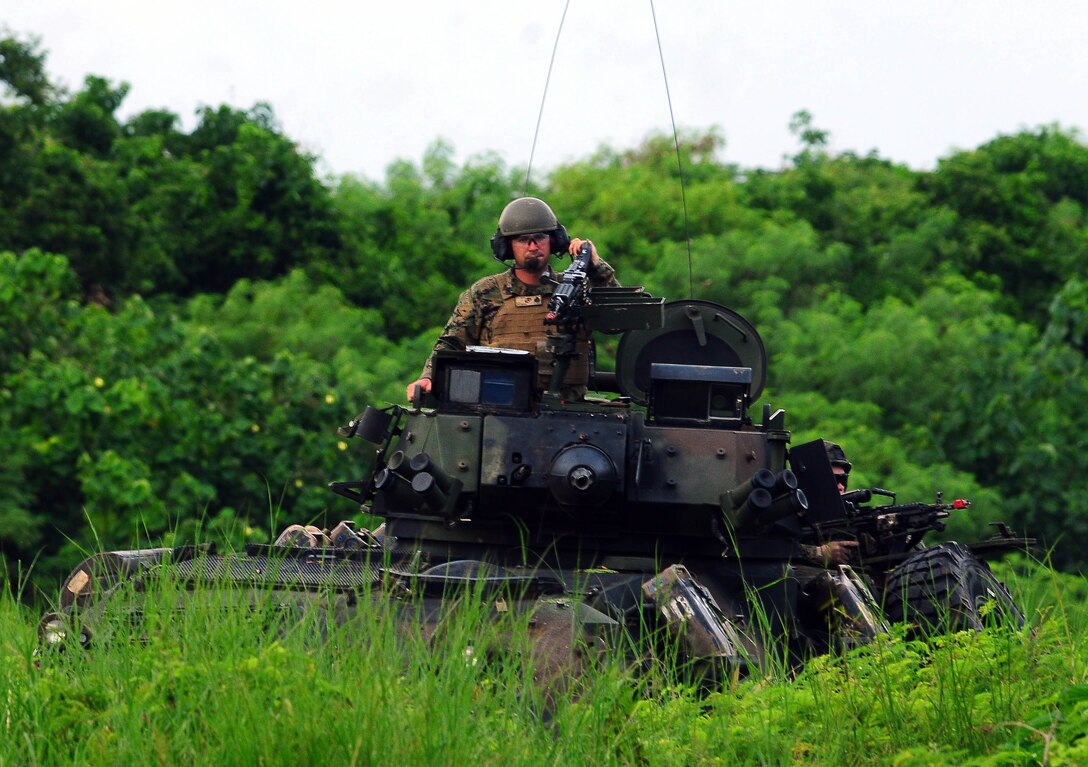 ANDERSEN AIR FORCE BASE, Guam – More than 130 Marines attached to the 3rd Reconnaissance Battalion stormed into Andy South during an exercise in support of Valiant Shield 2010. Twenty-five 736th Security Forces Squadron Airmen participated as opposing forces, defending the mission objective against the 3rd RB. The Battalion is based out of Camp Schwab, a satellite base of Marine Corps Base Camp Smedley D. Butler, on the Okinawa Prefecture, Japan. Missions performed during the training included, long-range reconnaissance and surveillance, tactical recovery of aircraft personnel, hydro-graphic surveys and beach reconnaissance, small unit raids and selected prisoner snatches, underwater searches, and evacuation of American Civilians from  hostile environments. (U.S. Air Force photo by Airman Julian North)