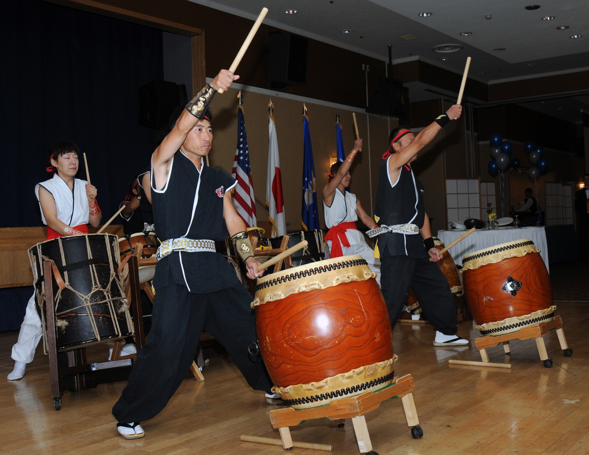 Members of the Towada Kaminari Suijin Thunder Drummers, a Tiako Drum team, perform at Misawa Air Base, Japan, for the 35th Fighter Wing and guests during the Air Force Ball commemorating the 63rd anniversary of the Air Force, Sep 25, 2010.  Taiko, meaning great or wide drum, is a percussion instrument used for classical and traditional Japanese folk music. (U.S. Navy photo by Mass Communication Specialist 2nd Class Matthew M. Bradley /Released)