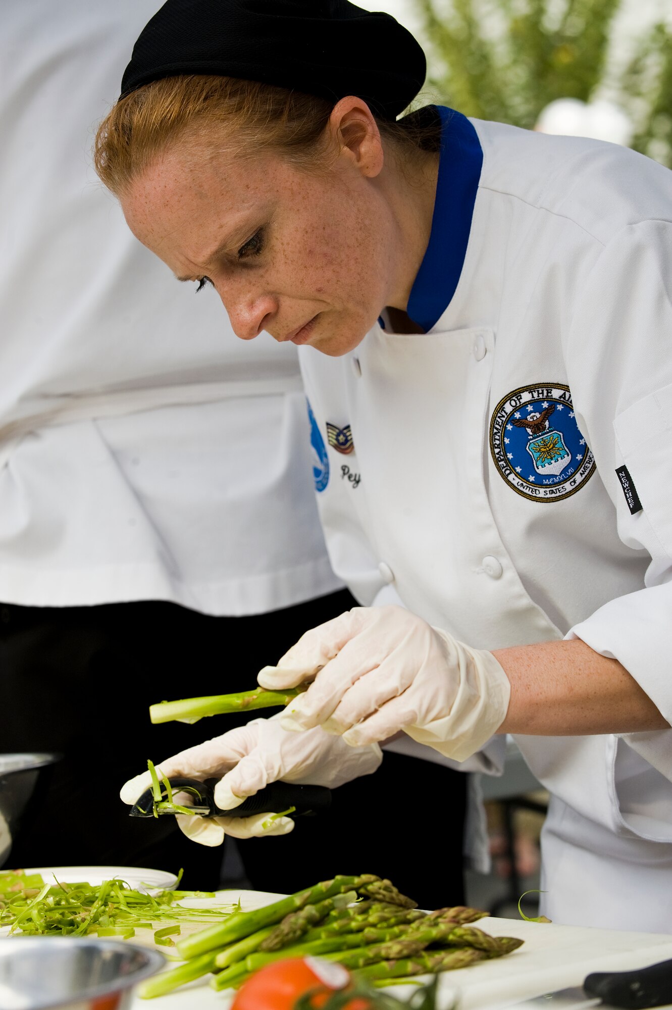 Tech. Sgt. Pam Peyton shaves asparagus while preparing an entree for the 7th Annual Military Culinary Competition, Sept. 25, 2010, in Washington, D.C. Each team created an entree with an accompanying soup, appetizer or desert. Sergeant Peyton is the front house manager of the Air Force executive dinning facility at the Pentagon. (U.S. Air Force photo/Tech. Sgt. Bennie J. Davis III)