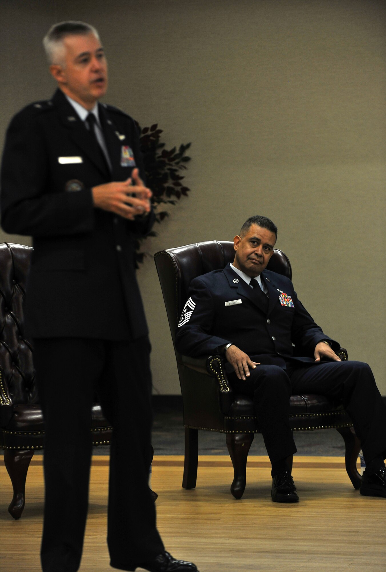 MOODY AIR FORCE BASE, Ga. -- Chief Master Sergeant Paul Burgess, former Command Chief Master Sergeant, 332d Air Expeditionary Wing, Joint Base Balad, Iraq looks at Brig. Gen. Kenneth Todorov, Director, Standing Joint Force Headquarters, U.S. Northern Command, Peterson Air Force Base, Colo. while he speaks about working with Chief Burgess here Sept. 10 . During the ceremony, General Todorov read an email from Maj. Gen. Craig Franklin, 332d Air Expeditionary Wing commander, that read “Chief Burgess led by example.  He was everywhere across the base, at all hours and shifts checking on our Airmen.  He often accompanied our security forces Airmen on outside the wire patrols in full battle-rattle.  He was quite proud that he could keep up with the youngsters even in 115 plus degree temperatures.  He's what a chief should be and we were privileged to have him as our command chief.” (U.S. Air Force photo/Airman 1st Class Joshua Green)

