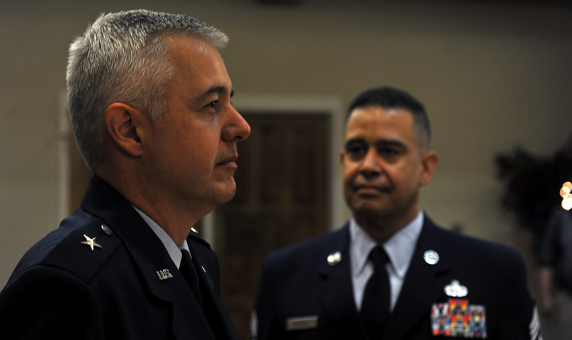 MOODY AIR FORCE BASE, Ga. -- Brig. Gen. Kenneth Todorov, Director, Standing Joint Force Headquarters, U.S. Northern Command, Peterson Air Force Base, Colo. and Chief Master Sergeant Paul Burgess, former Command Chief Master Sergeant, 332d Air Expeditionary Wing, Joint Base Balad, Iraq stand at attention during the playing of color here Sept. 10. The retirement was the first time the two friends have been reunited since working together as the 23rd Wing commander and command chief. (U.S. Air Force photo/Airman 1st Class Joshua Green)
