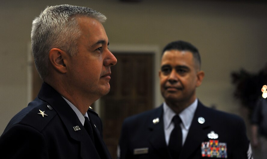 MOODY AIR FORCE BASE, Ga. -- Brig. Gen. Kenneth Todorov, Director, Standing Joint Force Headquarters, U.S. Northern Command, Peterson Air Force Base, Colo. and Chief Master Sergeant Paul Burgess, former Command Chief Master Sergeant, 332d Air Expeditionary Wing, Joint Base Balad, Iraq stand at attention during the playing of color here Sept. 10. The retirement was the first time the two friends have been reunited since working together as the 23rd Wing commander and command chief. (U.S. Air Force photo/Airman 1st Class Joshua Green)
