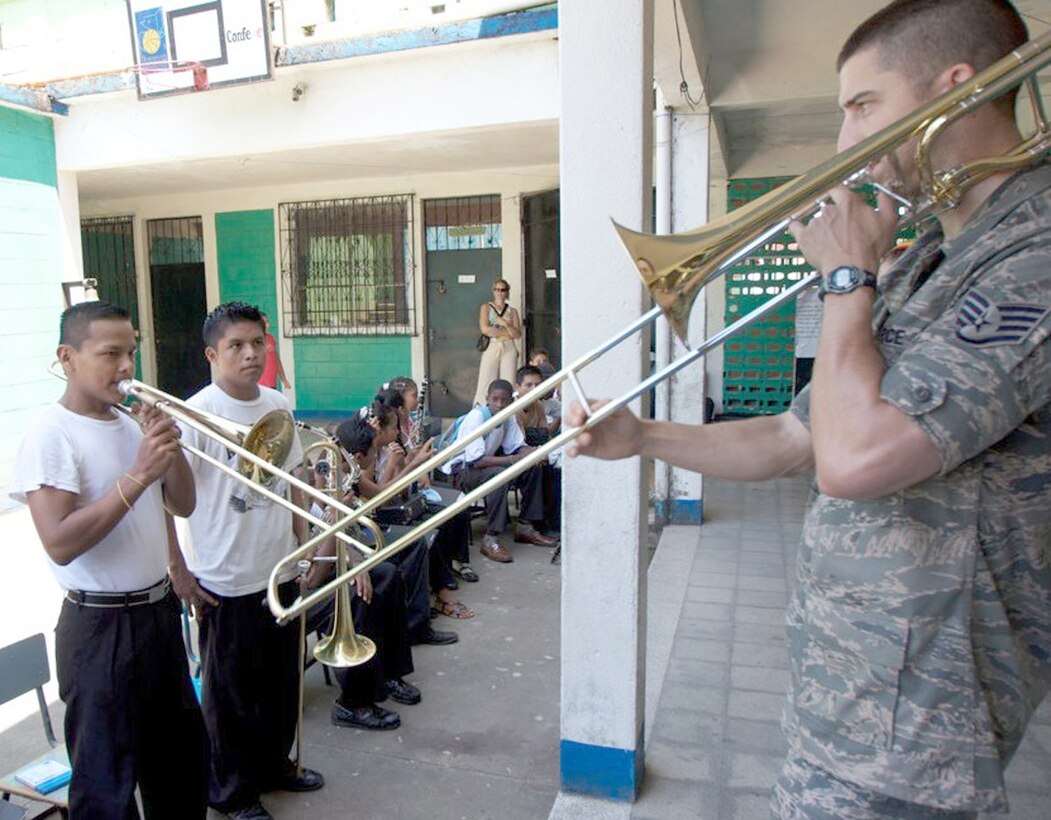 Staff Sgt. Doug Kost leads a student during a workshop Sept.  27, 2010,  in Livingston, Guatemala. The United States Air Force Band of Flight's deployed ensemble, New Harmony, recently played for more than 5,000 people in Guatemala as part of a United States Southern Command humanitarian mission in support of the Navy's Operation Continuing Promise. Sergeant Kost is a New Harmony ensemble member. (U.S. Air Force photo/Maj. R. Michael Mench)