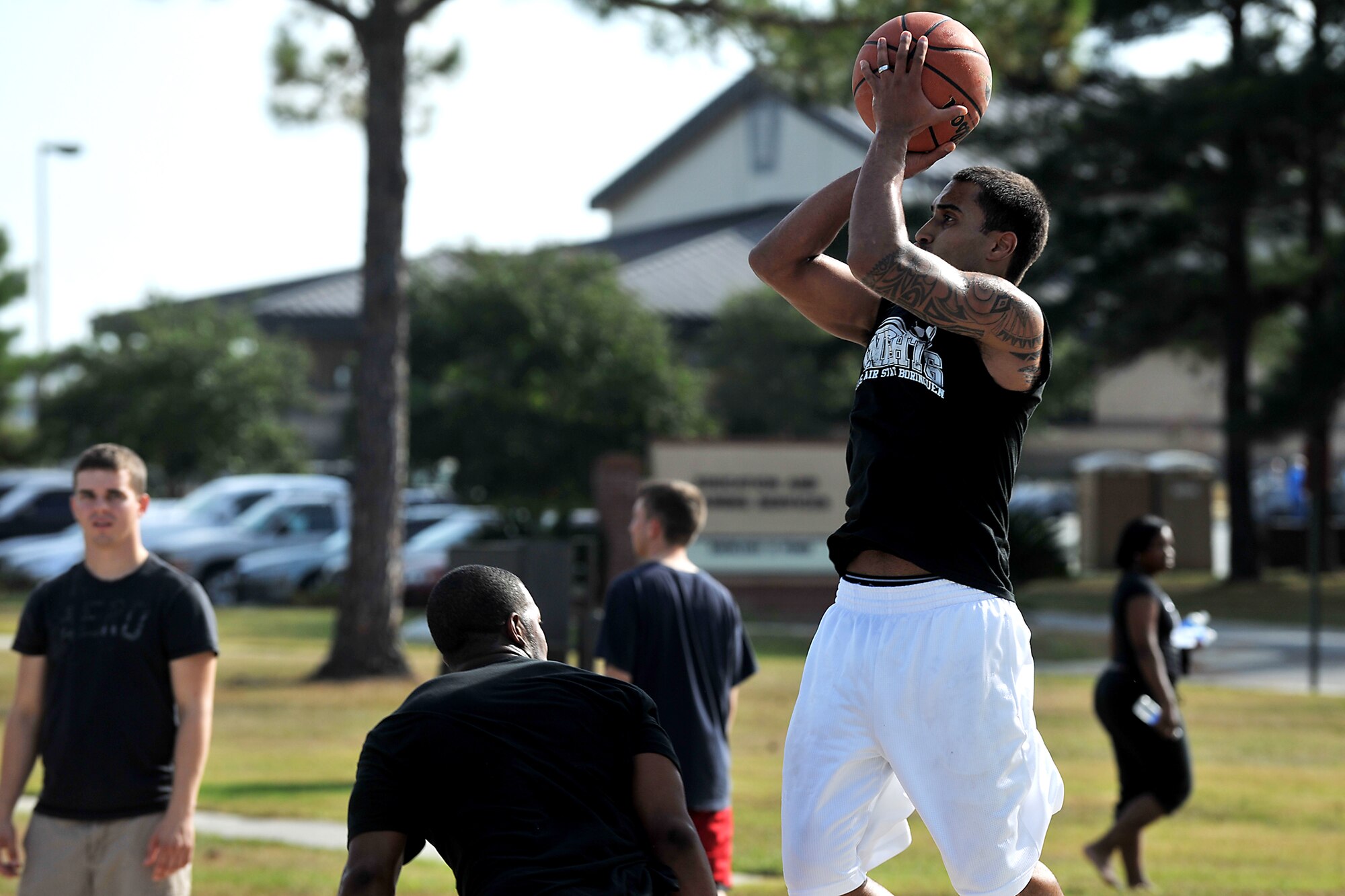 MOODY AIR FORCE BASE, Ga. -- An Airman from Moody takes a shot over a defender during a basketball game at Airmen Appreciation Day here Sept. 24. Airmen Appreciation was designed for The rank of Senior Airman and below to participate in a day filled with activities and no work.       (U.S. Air Force photo/Airman 1st Class Joshua Green)
