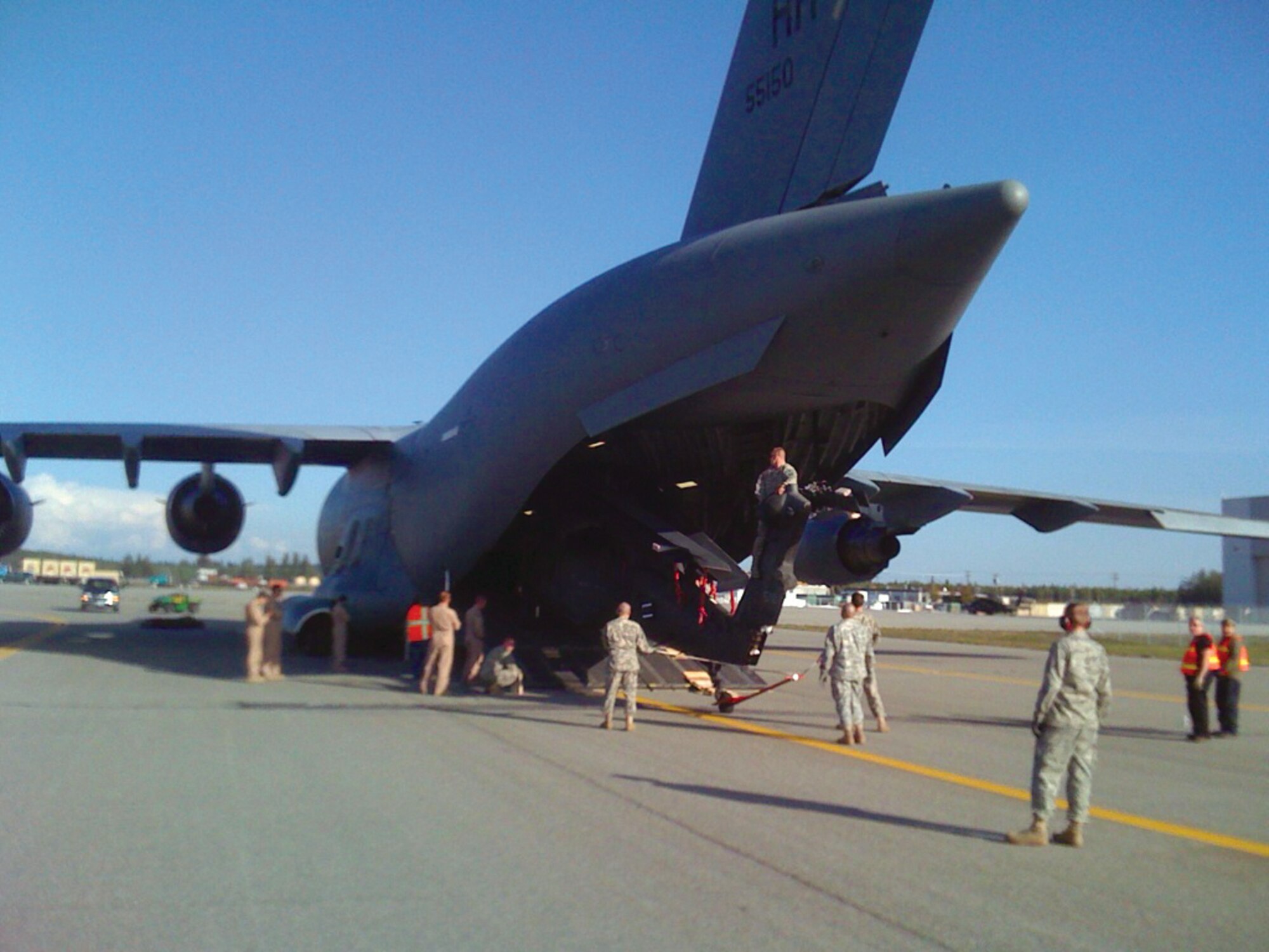 Personnel load a UH-60 Black Hawk helicopter onto a C-17 Globemaster III aircraft after inspection at Fort Wainwright, earlier this month. (Courtesy photos)