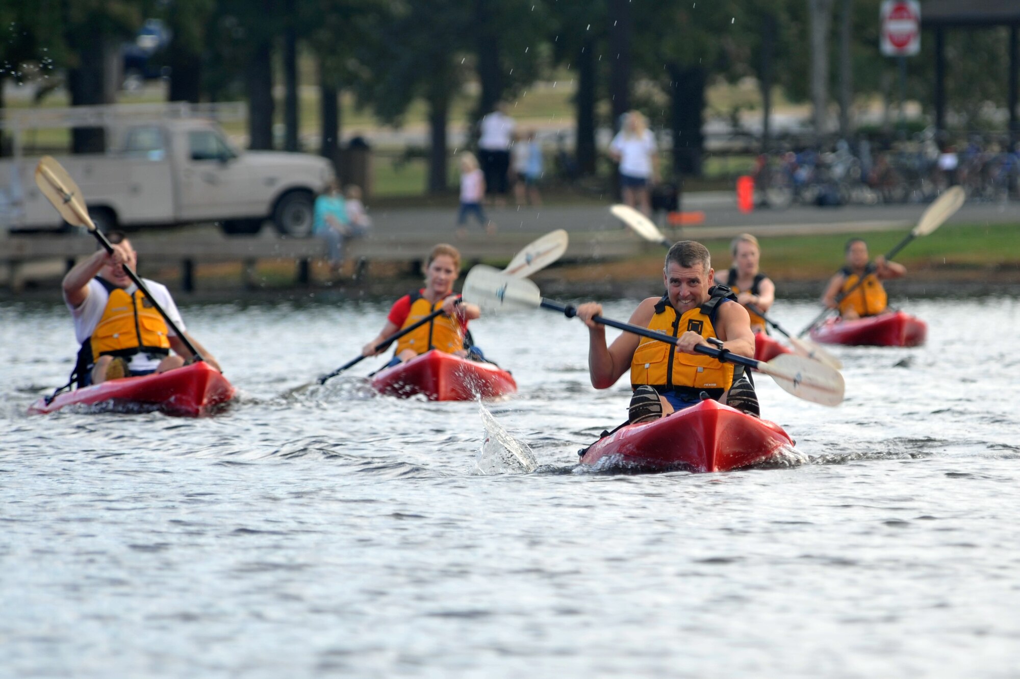 A group of competitors paddle their way through the first portion of the ‘Round the Rock Adventure Race Sept. 25.  Several members from Team Little Rock participated in the event that combined kayaking around the big base lake, a 14.1-mile bike-trail course and a 5-kilometer run, ending at Hanger 1080. (U.S. Air Force photo by Staff Sgt. Chris Willis)