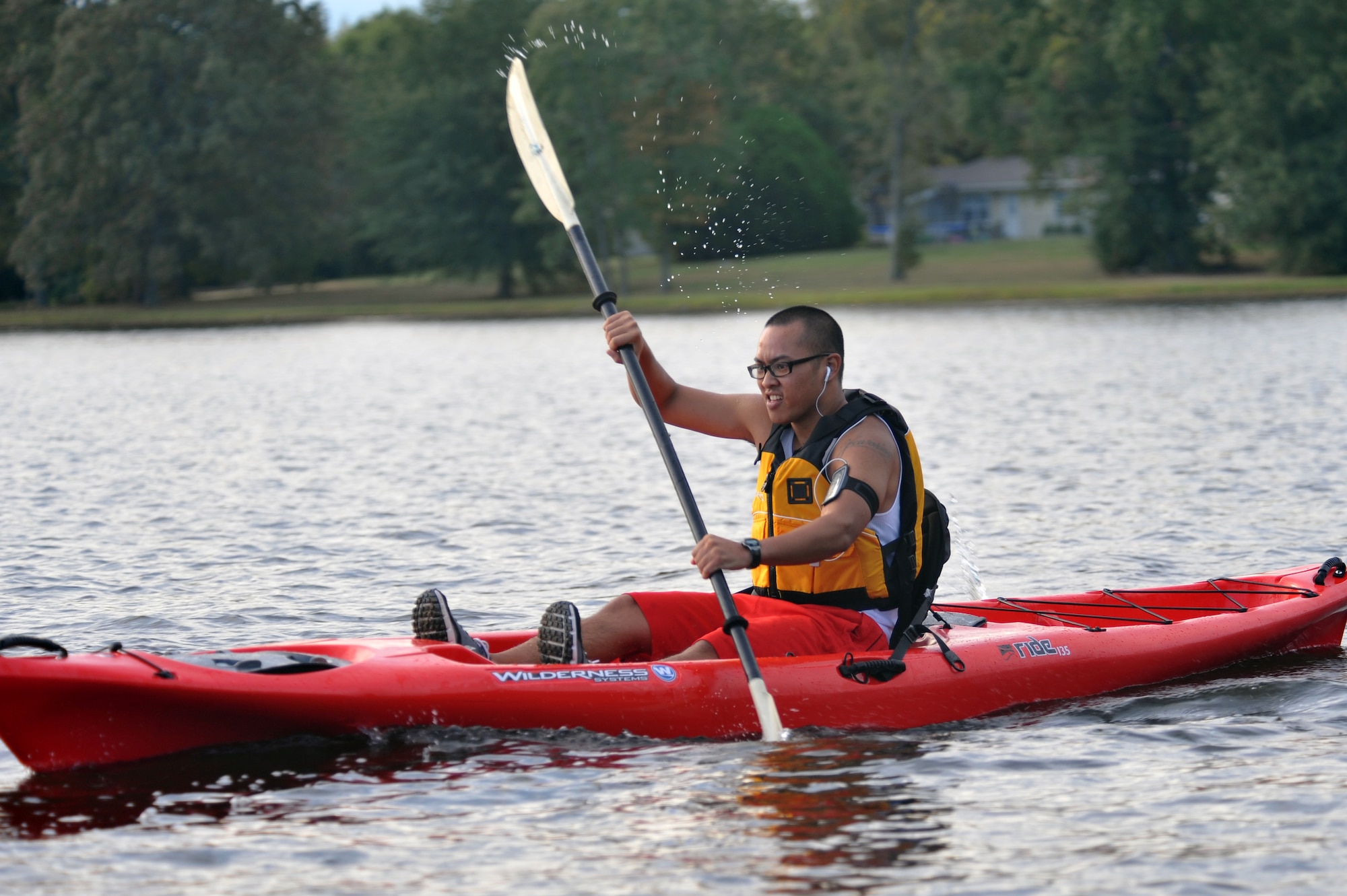 Airman Andrew Lavarias, 62nd Airlift Squadron, maneuvers his kayak around the perimeter of the base lake Sept. 25.  Several members from Team Little Rock participated in the ‘Round the Rock Adventure Race that combined kayaking around the big base lake, a 14.1-mile bike-trail course and a 5-kilometer run, ending at Hanger 1080. (U.S. Air Force photo by Staff Sgt. Chris Willis)