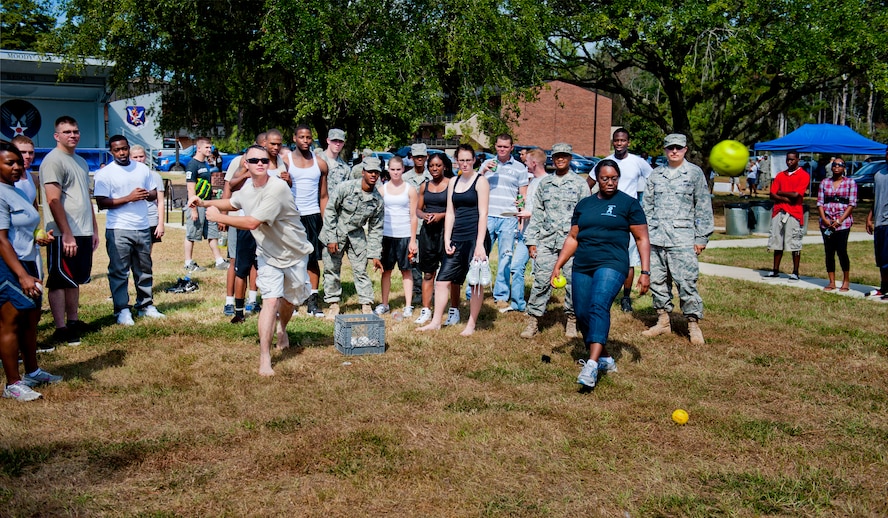 MOODY AIR FORCE BASE, Ga. -- Senior Airman Paul Smith, 23rd Communications Squadron airfield systems technician, takes a shot at dunking an Airman in a water booth during Airman Appreciation Day Sept. 24. Airmen and their families also participated in activities such as football, basketball and volleyball tournaments. (U.S. Air Force photo/Senior Airman Jamal D. Sutter)
