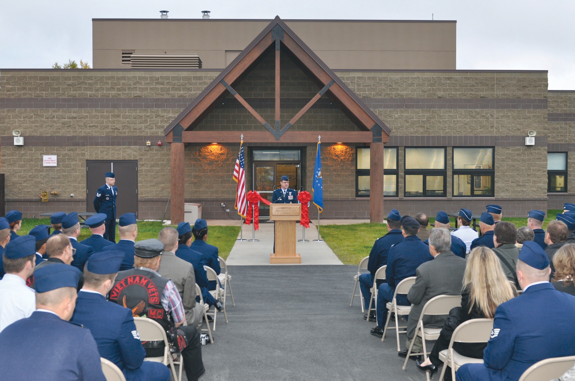 Air Force Col. Robert D. Evans, JBER/673d Air Base Wing commander, speaks at the opening ceremony for the new Professional Military Education center, Monday. (Photo by Luke Waack/JBER PAO)