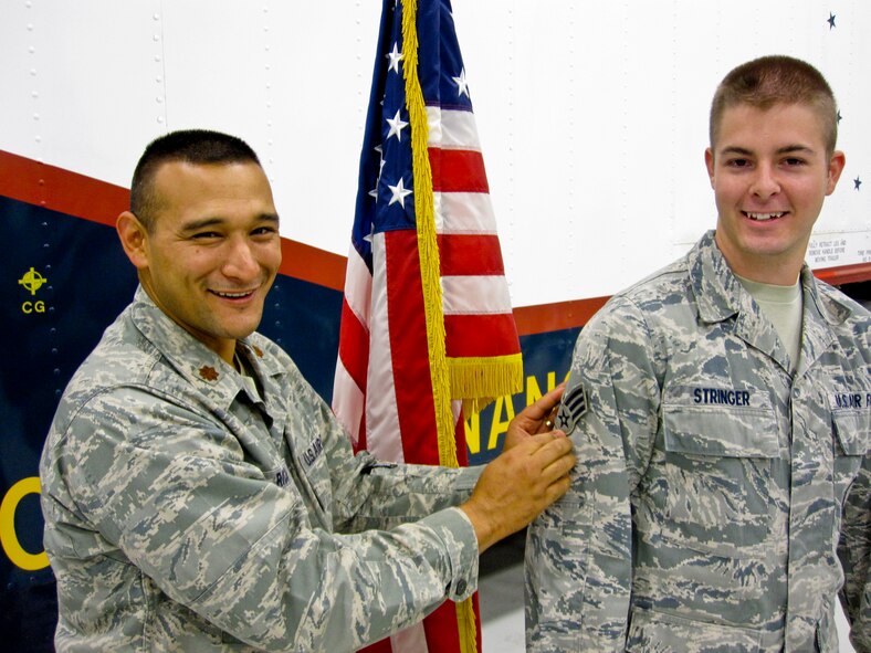 MINOT AIR FORCE BASE, N.D. -- Maj. Brian Rico, 91st Missile Maintenance Squadron commander, promotes Senior Airman Dustin Stringer, 91st MMXS technician and recent below-the-zone recipient here Sept. 20. Airman Stringer is an integral member of Air Force Global Strike Command. (Courtesy photo)