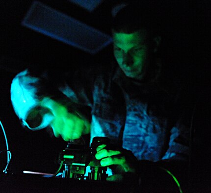 ELLSWORTH AFB, S.D. – Senior Airman Eric Schneider, 28th Operations Support Squadron aircrew flight equipment technician, tests night-vision goggles after maintenance, Sept. 23. The goggles are inspected and cleaned every 180 days, or when the need arises. (U.S. Air Force photo/Senior Airman Kasey Close)