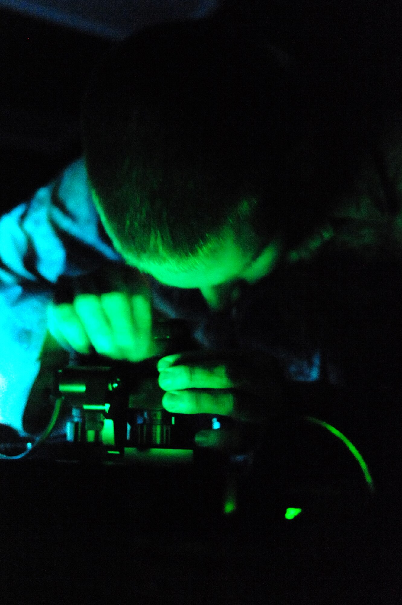 ELLSWORTH AFB, S.D. – Senior Airman Eric Schneider, 28th Operations Support Squadron aircrew flight equipment technician, tests night-vision goggles after maintenance by using an ANV-126A test set, Sept. 23. Airman Schneider maintained the goggles as part of a standard 180-day inspection. (U.S. Air Force photo/Senior Airman Kasey Close)