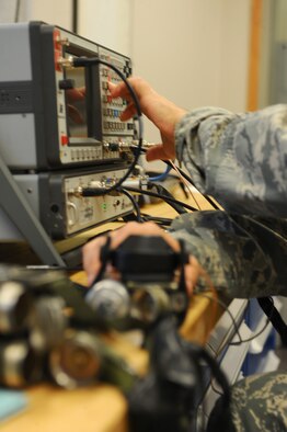 ELLSWORTH AFB, S.D. – Staff Sgt. Thomas Valenzuela, 28th Operations Support Squadron aircrew flight equipment technician, uses an RCTS-003 radio test system to test a survival radio. The radios are inspected every 60 days. (U.S. Air Force photo/Senior Airman Kasey Close)