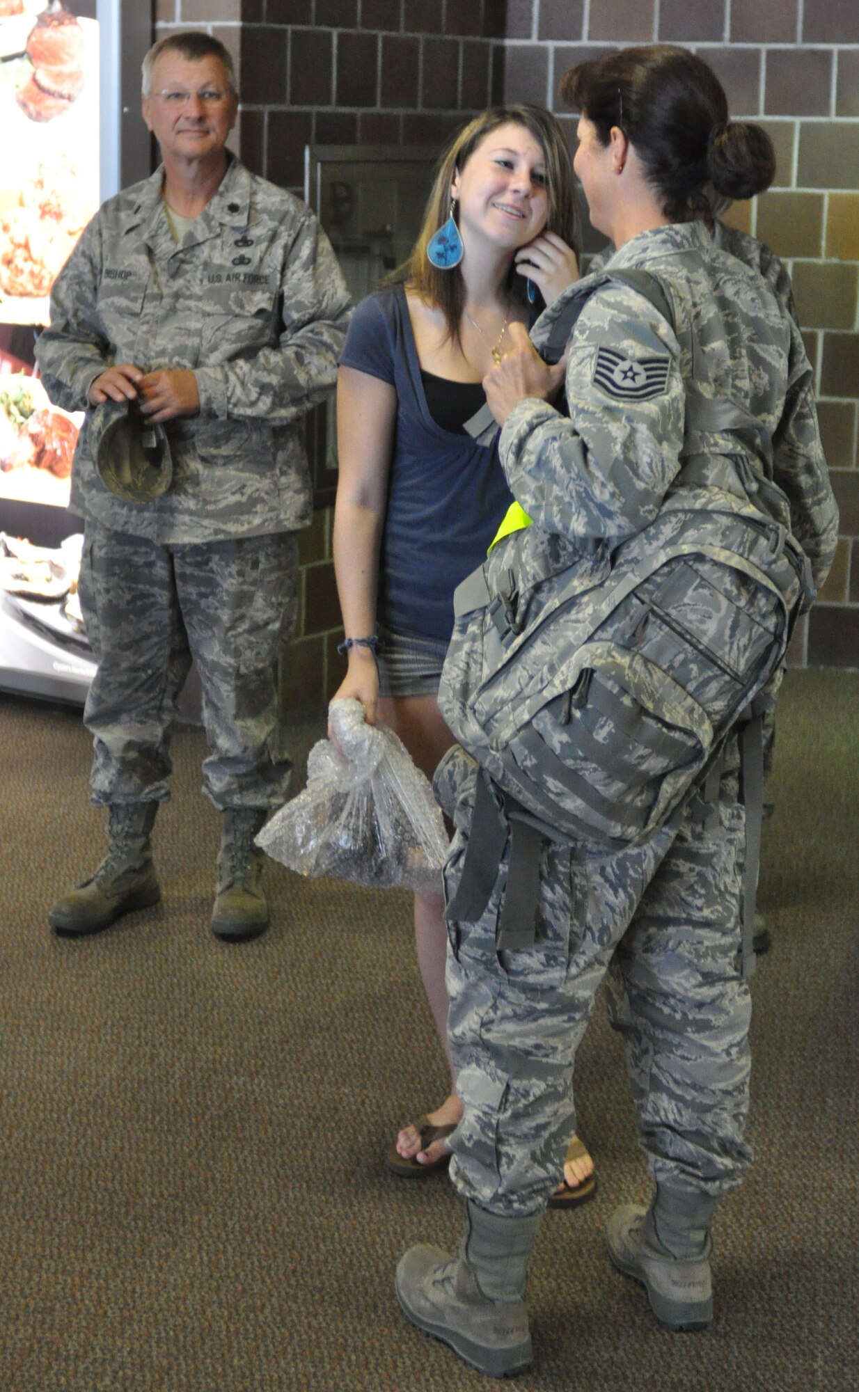 Tech. Sgt. Susan Strobel talks to her daughter Morgan Sept. 23, 2010 upon returning to Charleston, S.C. after a four month deployment to locations in Southwest Asia. Sergeant Strobel is with the 38th Aerial Port Squadron, Charleston Air Force Base, S.C. (U.S. Photo/Staff Sgt. Shane Ellis)