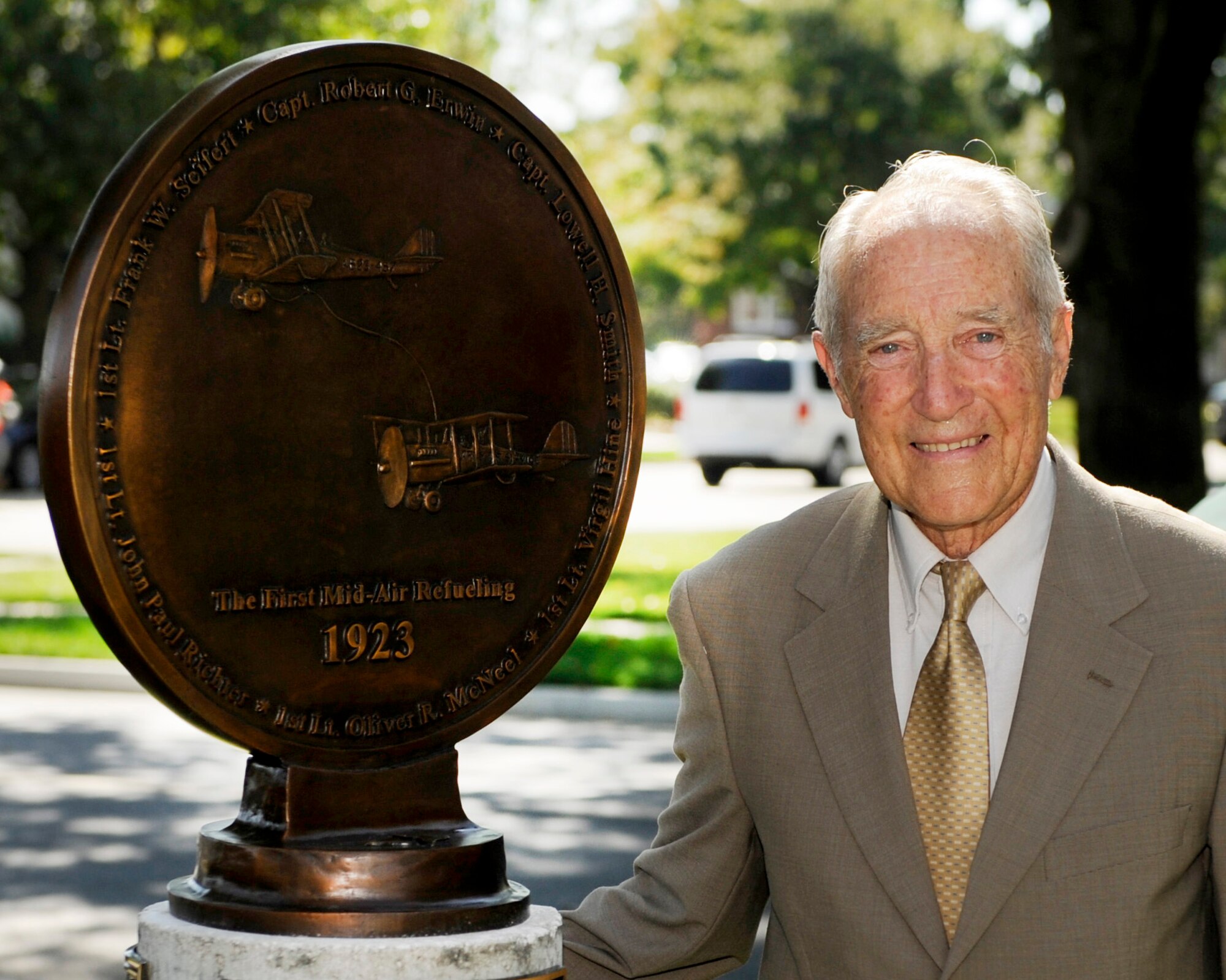 Dr. Ted Hine, a World War II Navy veteran and nephew of one of the original air refueling aircrew members who performed the first air refueling flights, represented family members of air refueling pioneers during a ceremony Sept. 23, 2010, at the “Walk of Fame” at Scott Air Force Base, Ill., as part of a presentation by the Airlift-Tanker Association Hall of Fame. Gen. Raymond E. Johns Jr., Air Mobility Command commander; retired Gen. Walter Kross, former AMC commander and A-TA chairman; and Dr. Hine were the main speakers for the event. They unveiled a two-sided bronze medallion highlighting “the pioneers of air refueling” who were the 2009 A-TA Hall of Fame inductees. (U.S. Air Force Photo/Staff Sgt. Ryan Crane)