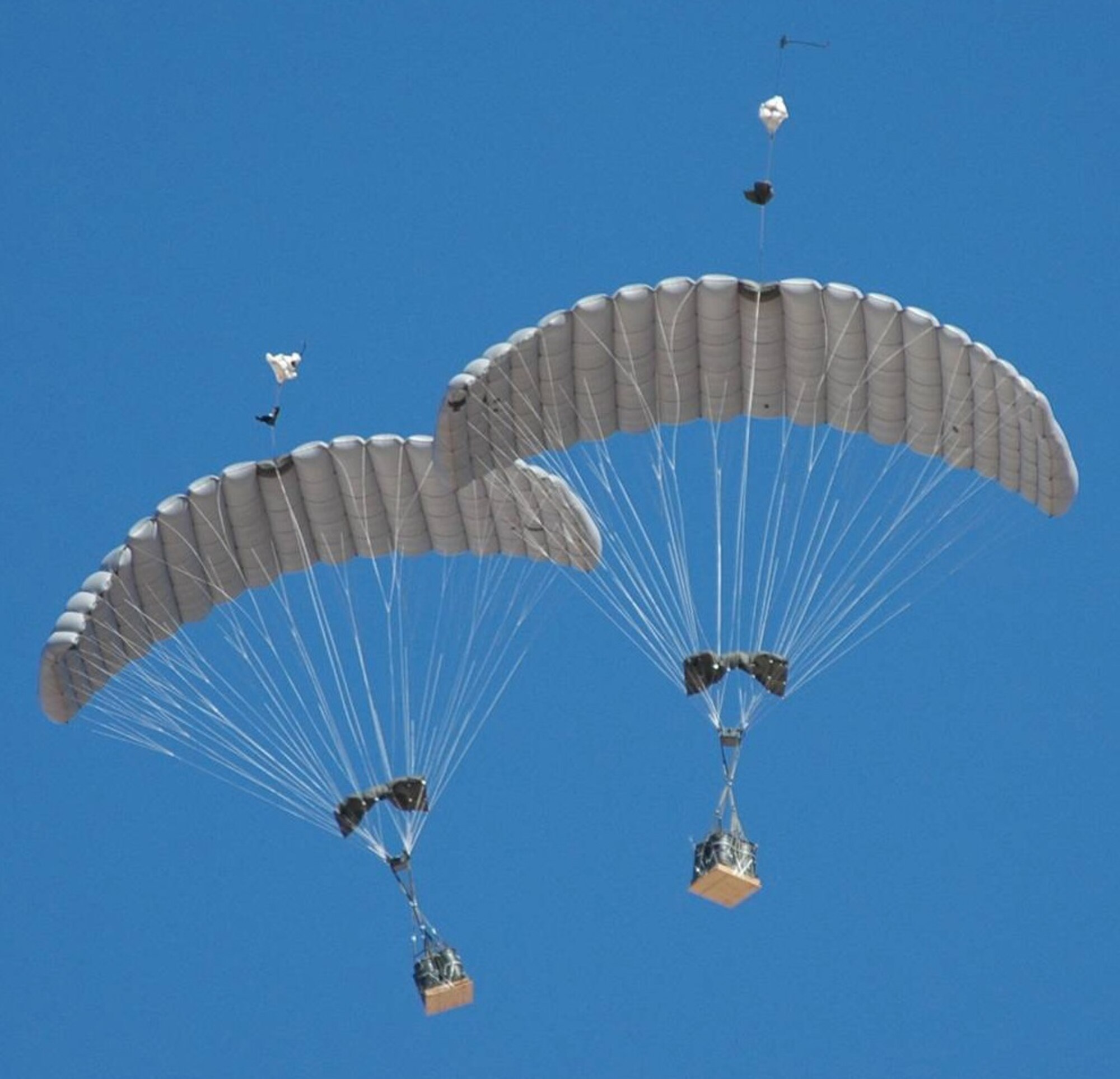 The guided payload 2,200 pound weight class of the Joint Precision Airdrop System in flight during its first combat airdrop. A joint Air Force, Army and contract team recently corrected an accuracy issue with this variant of JPADS. (Courtesy photo) 