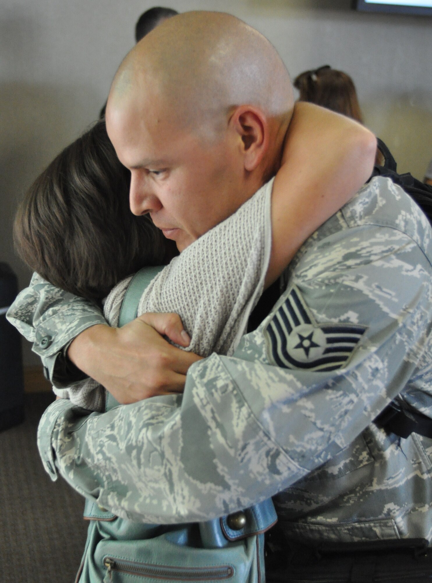 Tech. Sgt. Jorge Figueroa embraces his wife Nicole Sept. 23, 2010 upon returning to Charleston, S.C. after a four month deployment to locations in Southwest Asia. Sergeant Figueroa is with the 38th Aerial Port Squadron, Charleston Air Force Base, S.C. (U.S. Photo/Staff Sgt. Shane Ellis)