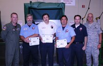 LAUGHLIN AIR FORCE BASE, Texas – Rick Myers, Mike Peabody, Joe Burato and Matthew Letts, all of the 47th Maintenance Directorate, pose with Col. Michael Frankel, 47th Flying Training Wing commander, and Chief Master Sgt. Mike Hanning, 47th FTW command chief, after Col. Frankel presented their unit the XLer of the Week award here Sept. 22. The XLer is chosen by wing leadership and given to individuals and units who continuously make outstanding contributions to Laughlin. (U.S. Air Force photo by Airman 1st Class Blake Mize) 
