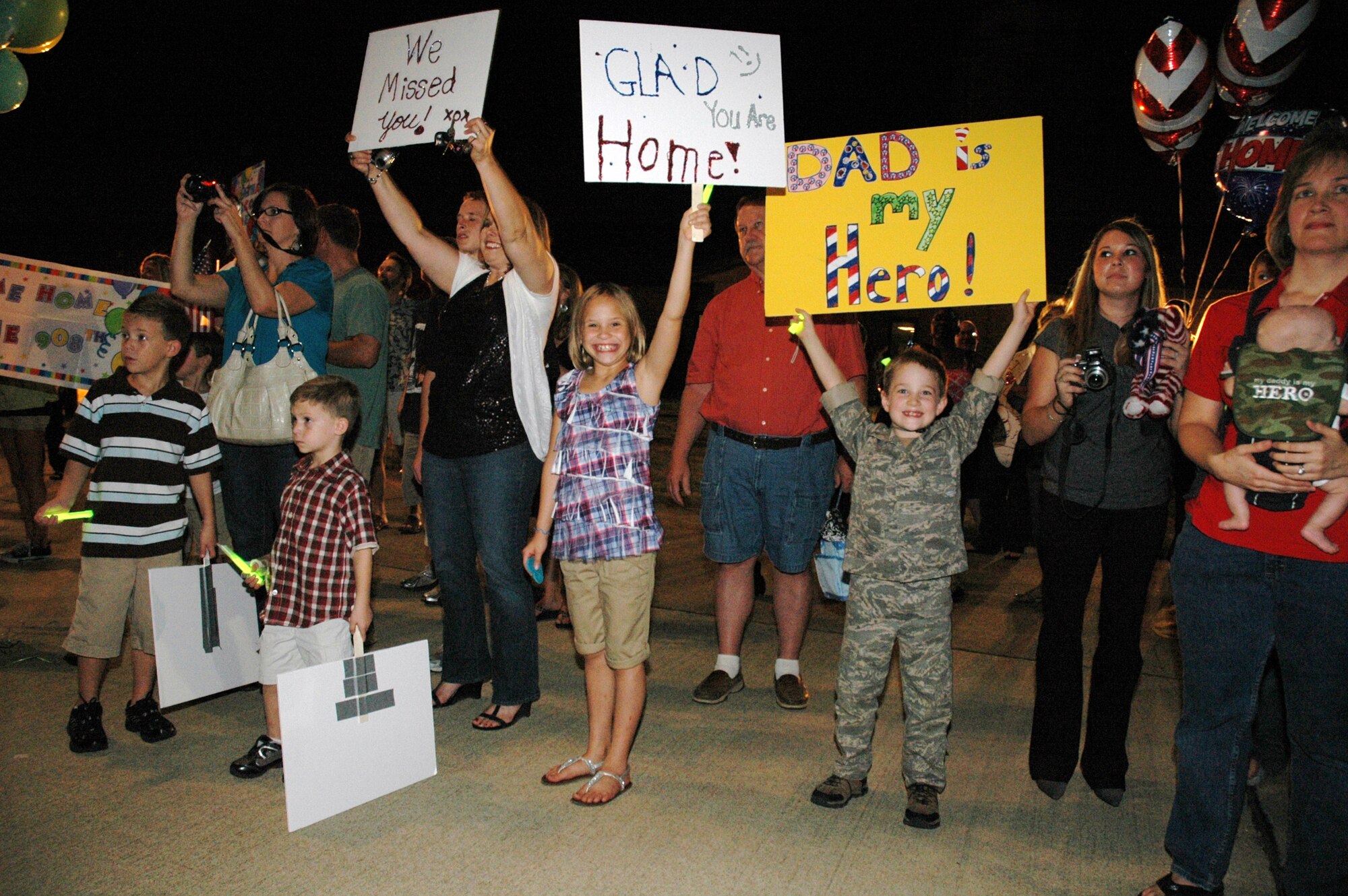 Family and friends await the arrival of the first group of Reservists at Maxwell AFB. Approximately 150 members of the 908th Airlift Wing recently returned from a four-month deployment to Southwest Asia. (Air Force photo by Lt. Col. Jerry Lobb)