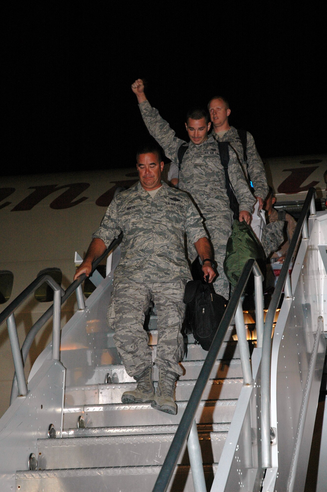 Travel-weary Reservists disembark a DC-10 at Maxwell AFB. Approximately 150 members of the 908th Airlift Wing recently returned from a four-month deployment to Southwest Asia.