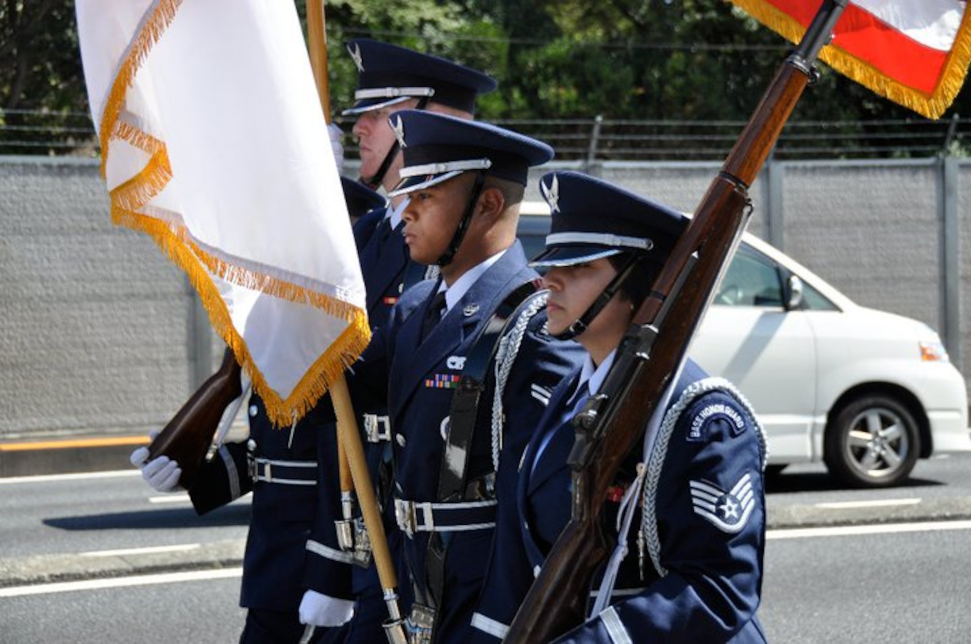 YOKOTA AIR BASE, Japan - The Yokota Air Base Honor Guard marks the start of the 2010 Fussa International Fair parade, September 26.  The parade was an opportunity for the 374th Airlift Wing to feature response vehicles as well as other unique aspects of Yokota to Fussa City and other parade spectators.  (U.S. Air Force photo/Capt. Tania Bryan)